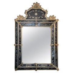 Venetian Mirror in Black and Gold Glass with Multiple Embellishments