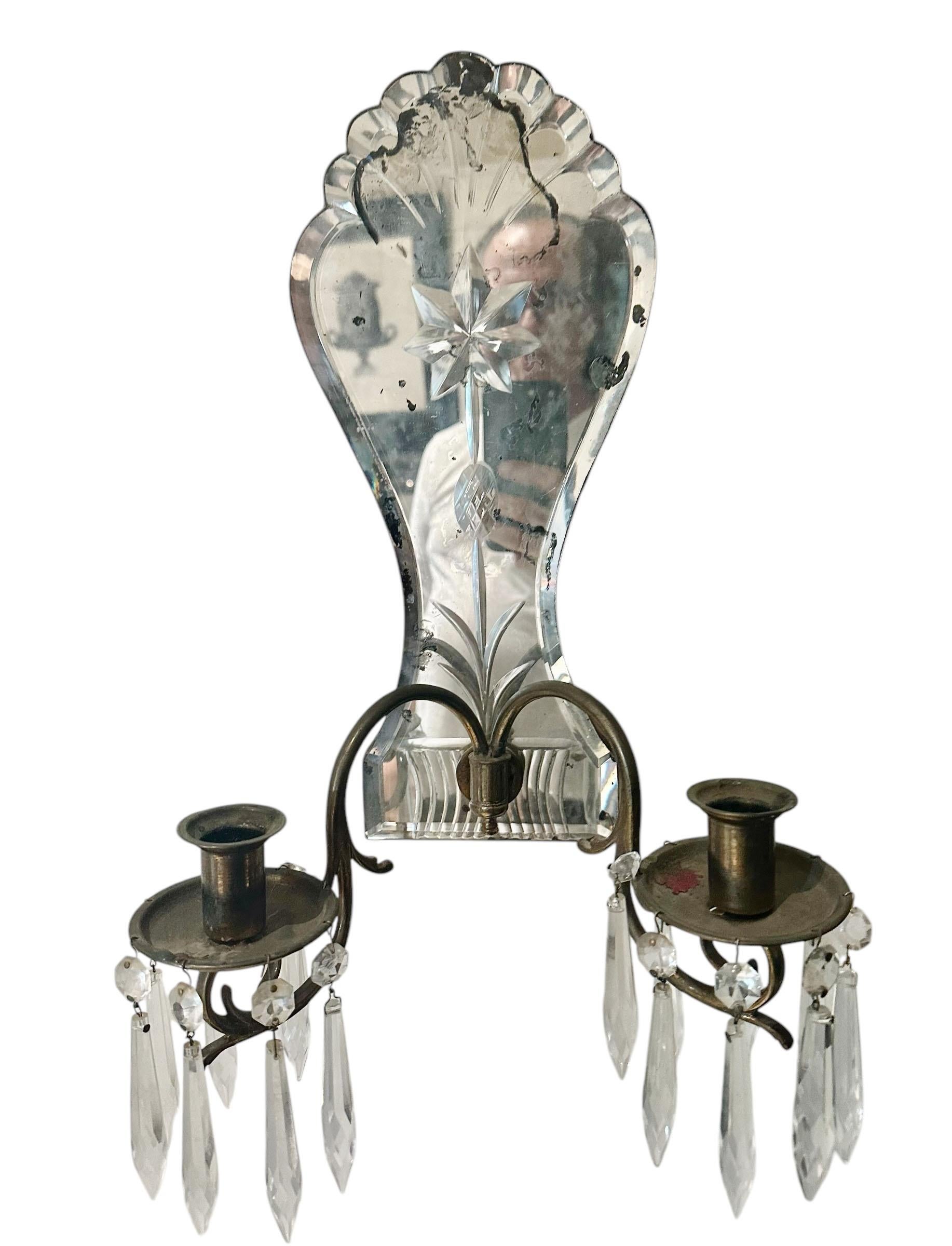 A pair of early 19th century mirrored candle scones from Italy. They were originally for candles but were once hard wired and could be done again. Circa 1800s to 1820s.