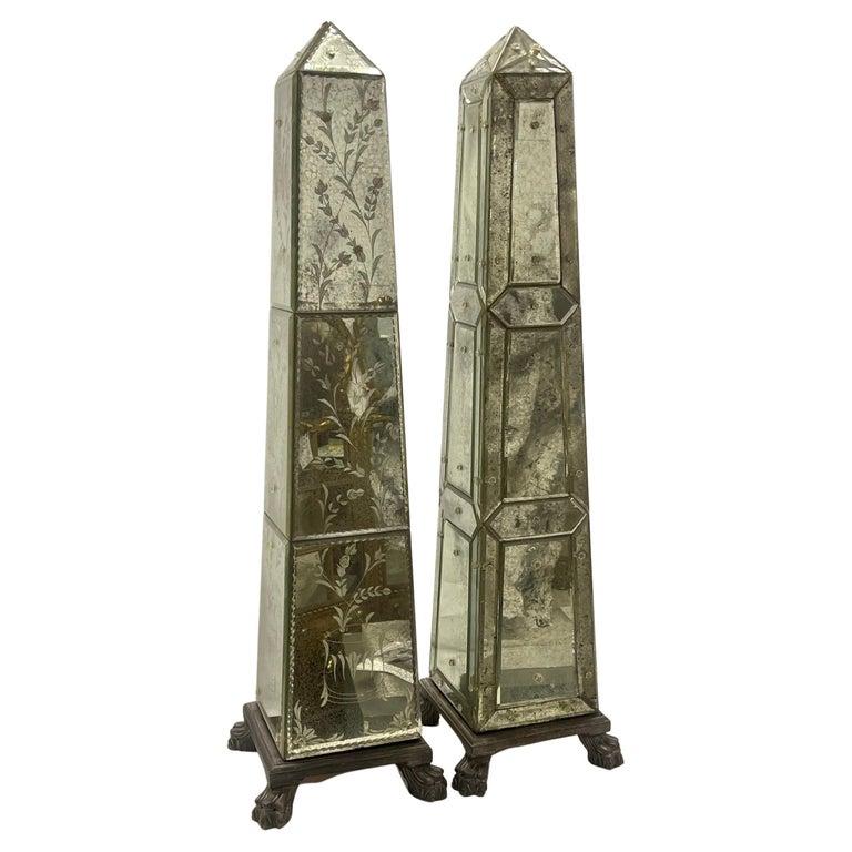 A Venetian mirrored obelisk. Having 12 Etched Glass Panels applied to four sides. The whole sitting on a wooden claw foot base. One of a compatible pair. Priced is for one only.