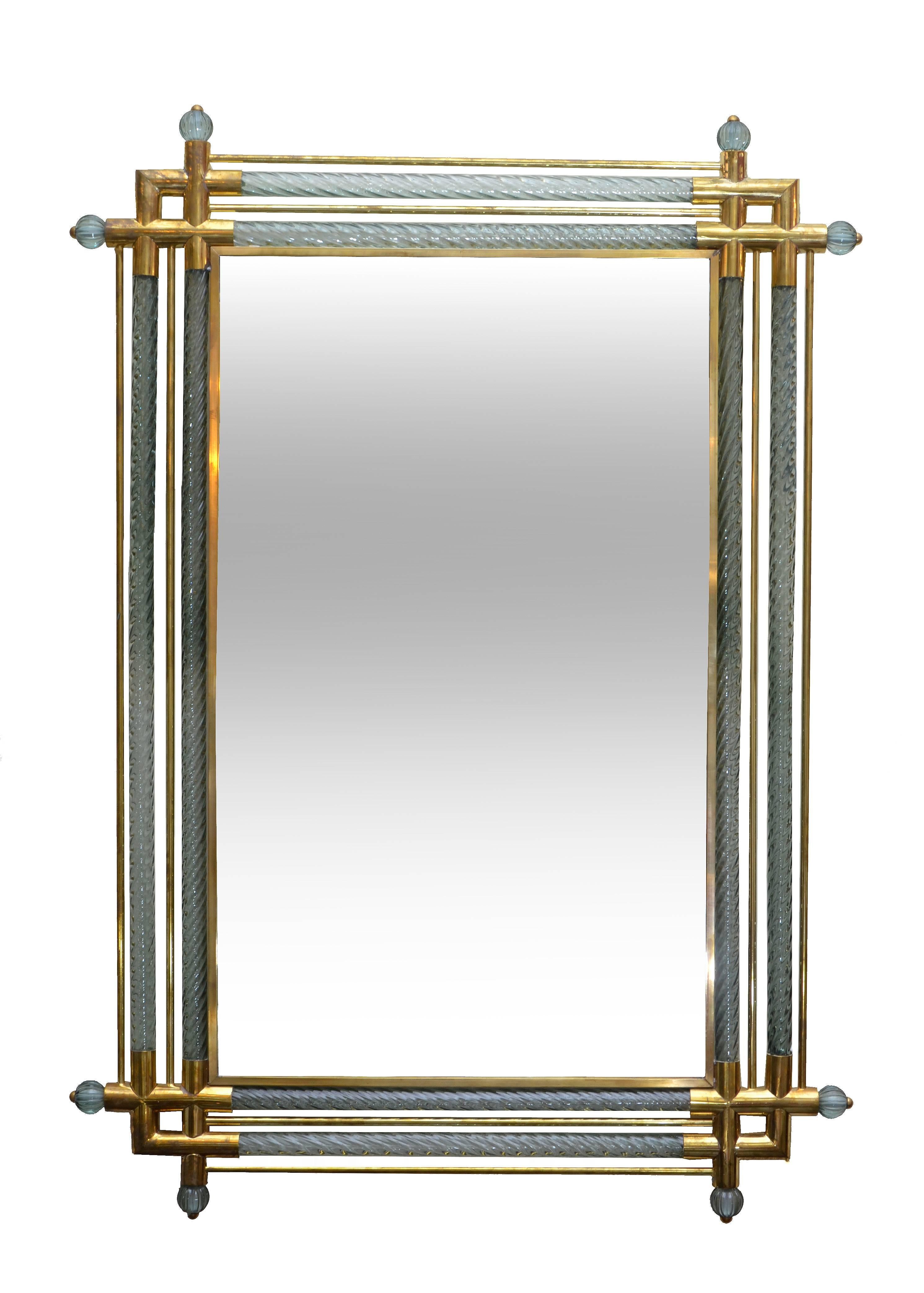 Venetian Mirror with double spiraled Murano glass border columns with brass tubular supports terminating with 2 glass balls at each corner.
Can be mounted in a portrait or landscape manner.
NOTE: Only ONE Mirror available.
