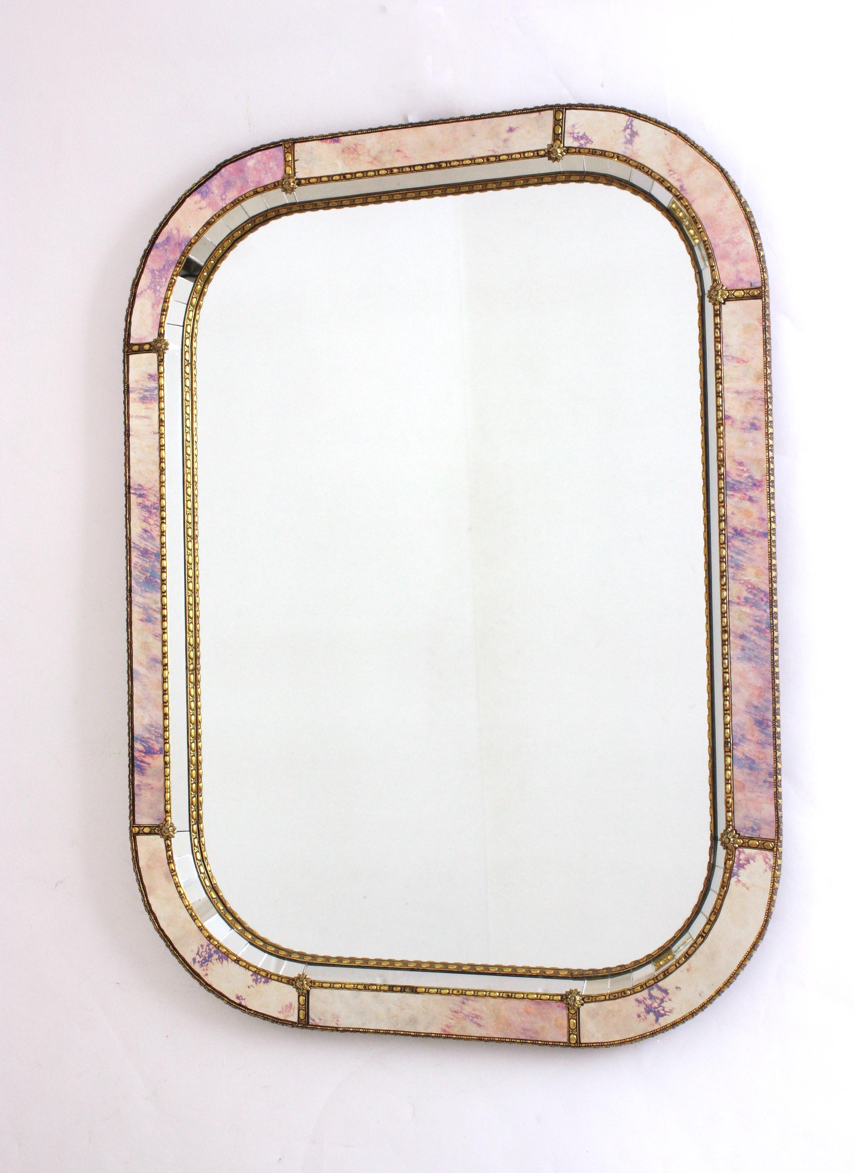Venetian Style Rectangular Wall Mirror
__________________________________________________________________________
Cool Venetian style Hollywood Regency rectangular mirror with iridiscent and mirror glass panels. Spain, 1960s
This glamorous wall