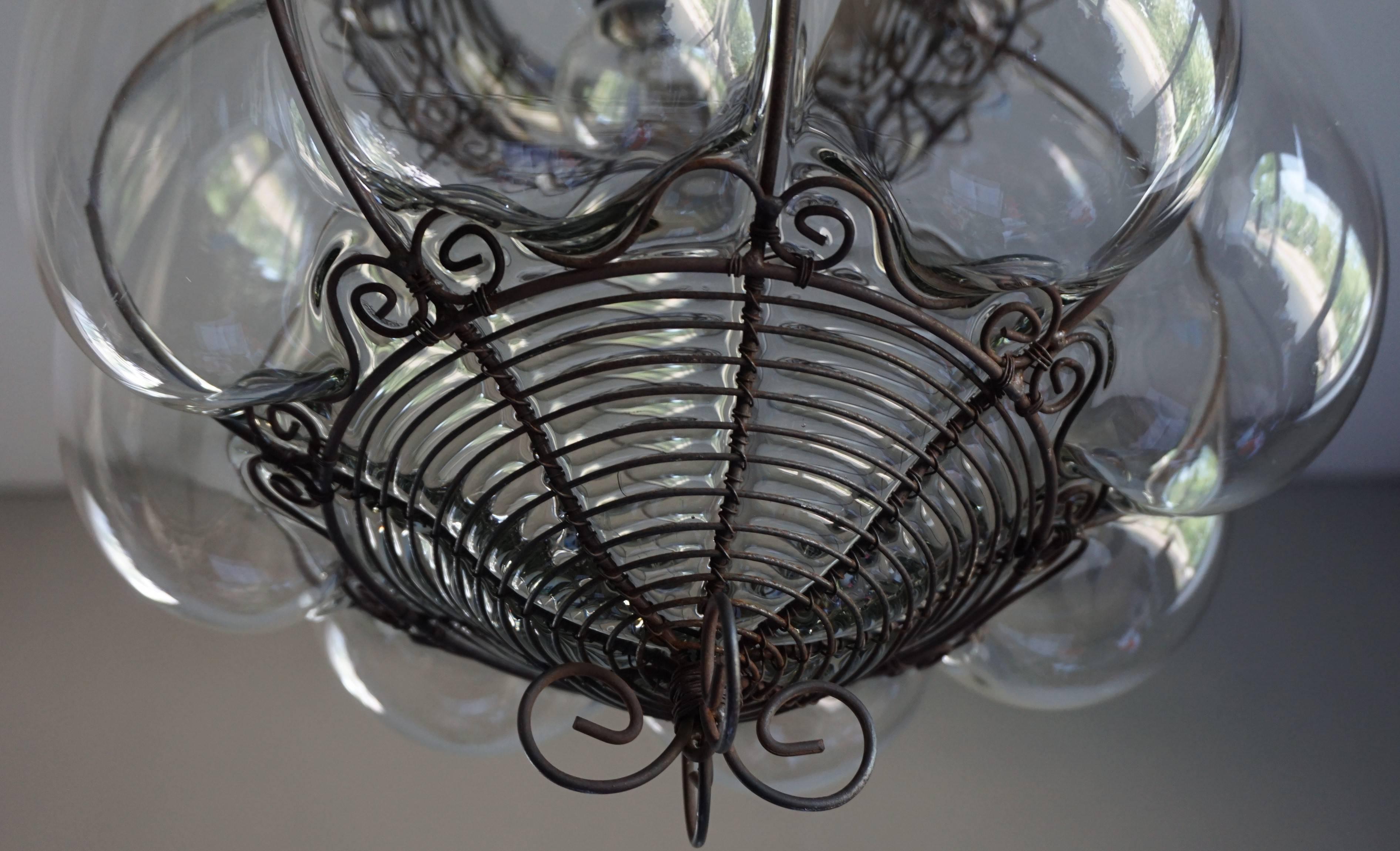 Italian Venetian Mouthblown Glass into a Hand-crafted Iron Frame Pendant Light Fixture For Sale