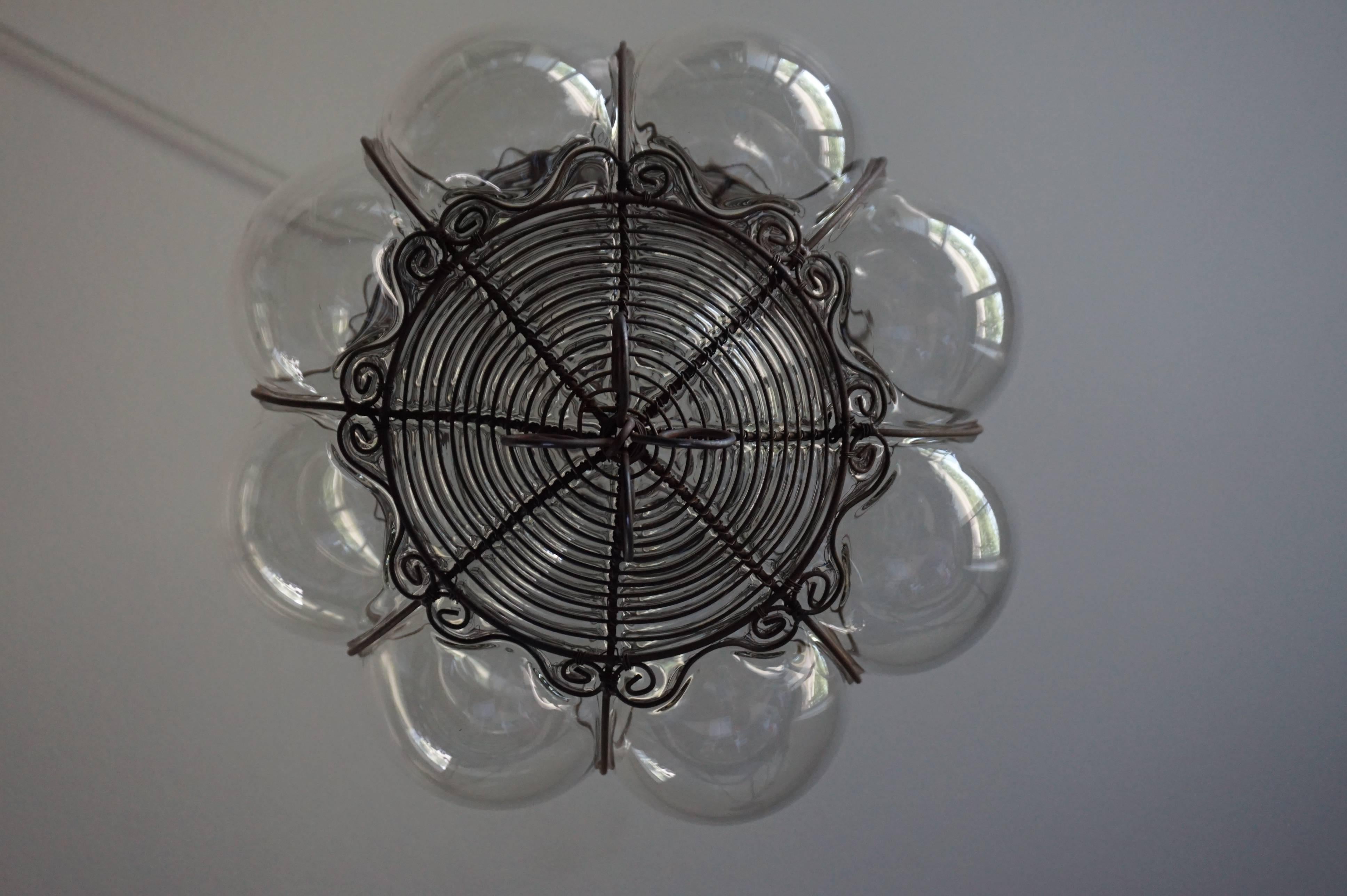 Metal Venetian Mouthblown Glass into a Hand-crafted Iron Frame Pendant Light Fixture For Sale