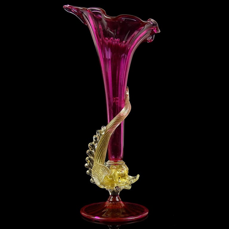 Beautiful, early antique Venetian hand blown amethyst pink and gold flecks Italian art glass fish stem flower vase. Created in the manner of the Salviati and Fratelli Toso companies. The fish is highly detailed, profusely covered in gold leaf, with