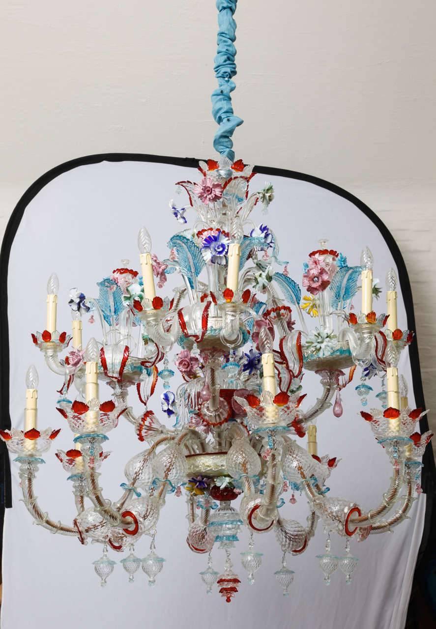 A big size coloured glass murano chandelier from Venezia (Venice) , Italy. The chandelier was made in the mid-century period. Each glass element is mouth-bown and made by hand. Note the colourful spectrum of the Murano manufacturers. The chandelier