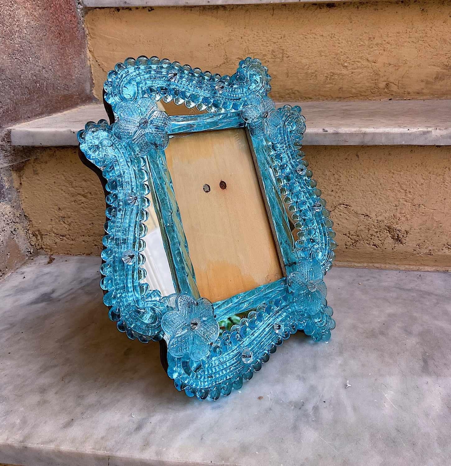 Stunning vintage Venetian Murano glass photo frame. Can also be hung on wall. Set on a wood base. Beautiful ice blue coloured glass.