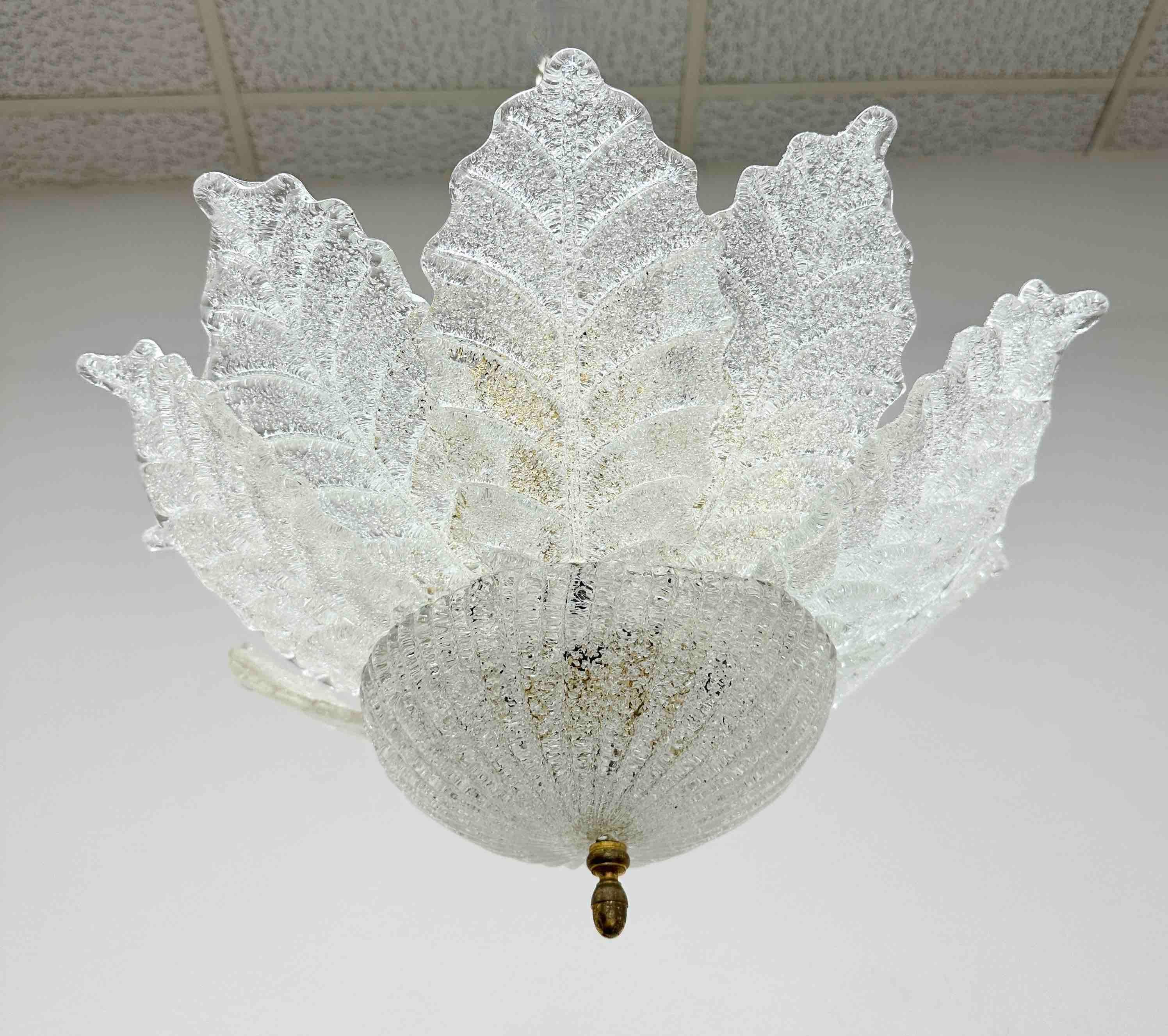 Very elegant, vintage estate, midcentury Venetian Murano art glass flush mount with clear Murano glass leaves hand blown in Graniglia technique to produce a granular textured effect, mounted on gold finish internal frame with a total of 6 lights.