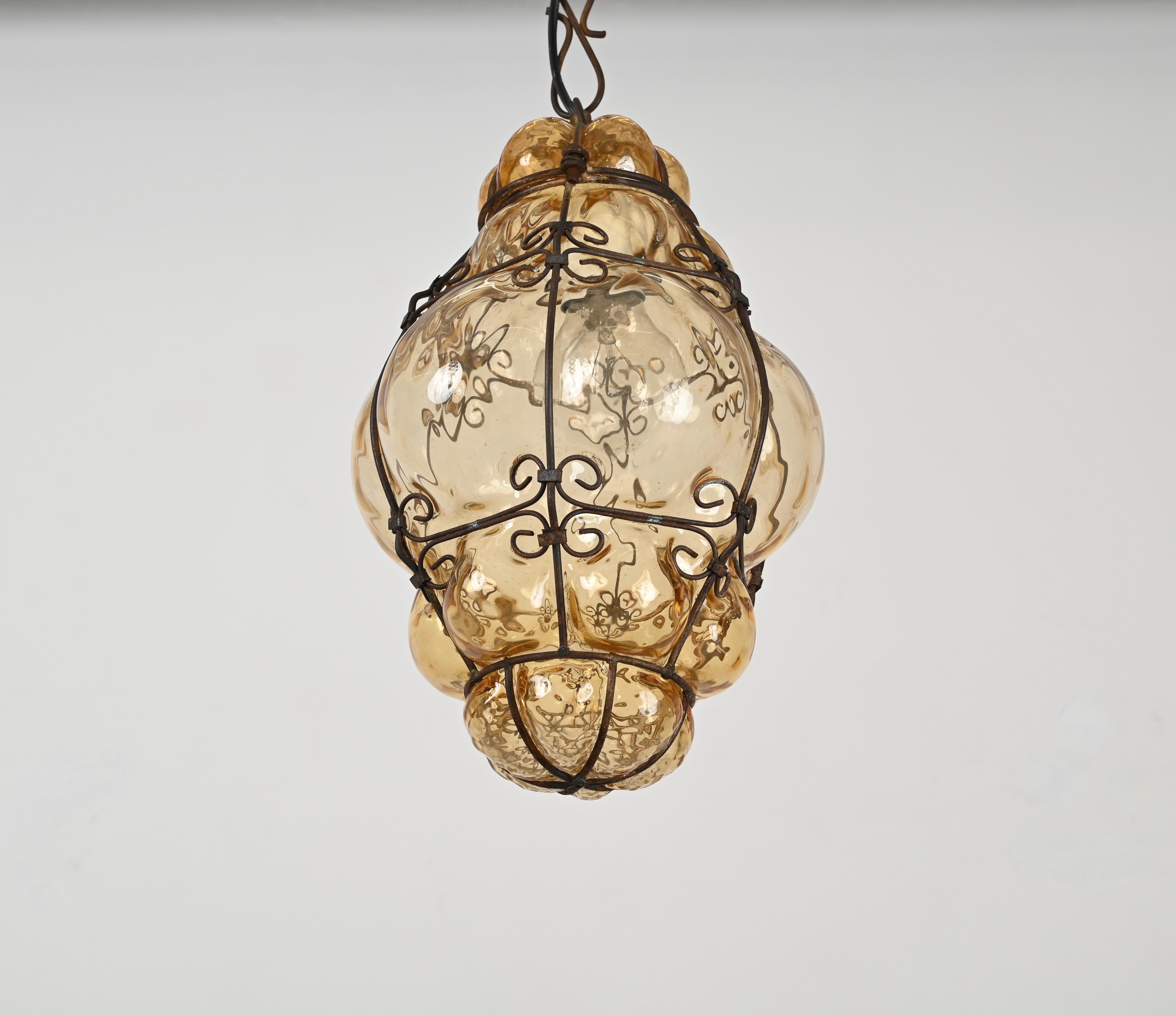 Mid-Century Modern Venetian Murano Mouthblown Amber Glass Chandelier with Iron Frame, Italy 1940s