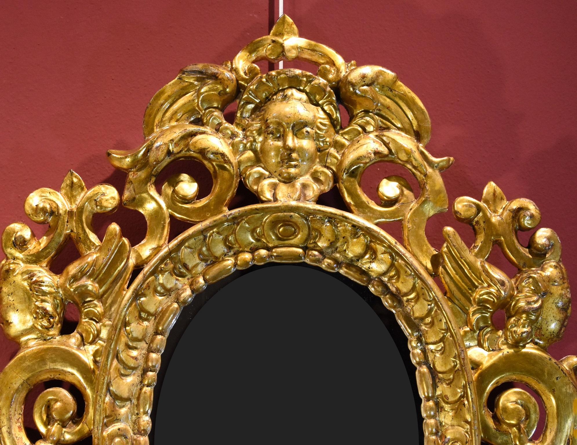 Pair of carved and gilded mirror cabinets 'in the manner of Sansovino'
Venetian (or Tuscan) carver active in the 18th century

Carved and gilded wood
Total frame measurements: 86 x 60 cm. /Internal measurements: 40 x 29 cm.

This precious pair of