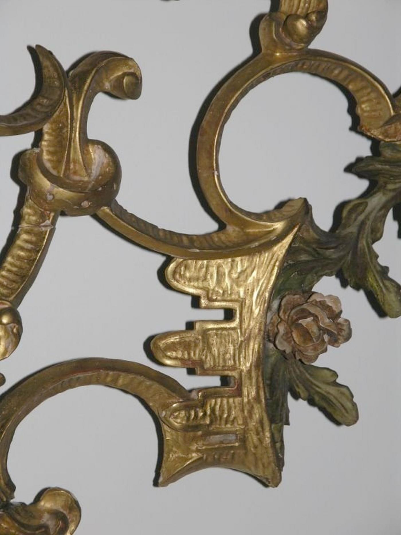 The arched plate within marginal borders and surmounted by a bold pierced foliate cresting leading to similar pendants, on C-scroll outswept feet centered by a leafy apron. 