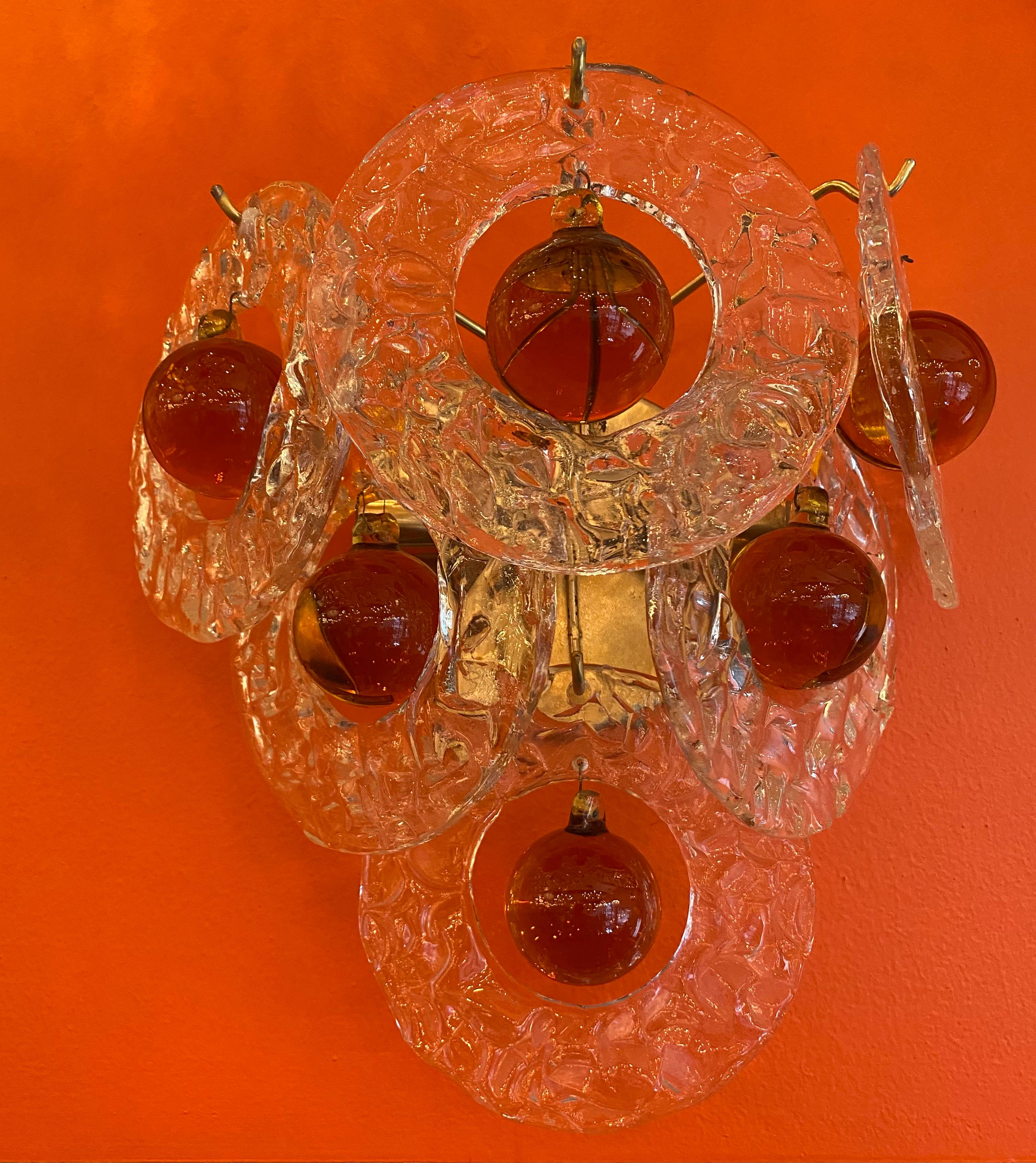 Pair of Venetian sconces, beautiful unique colors orange, and clear, with two lights ea.