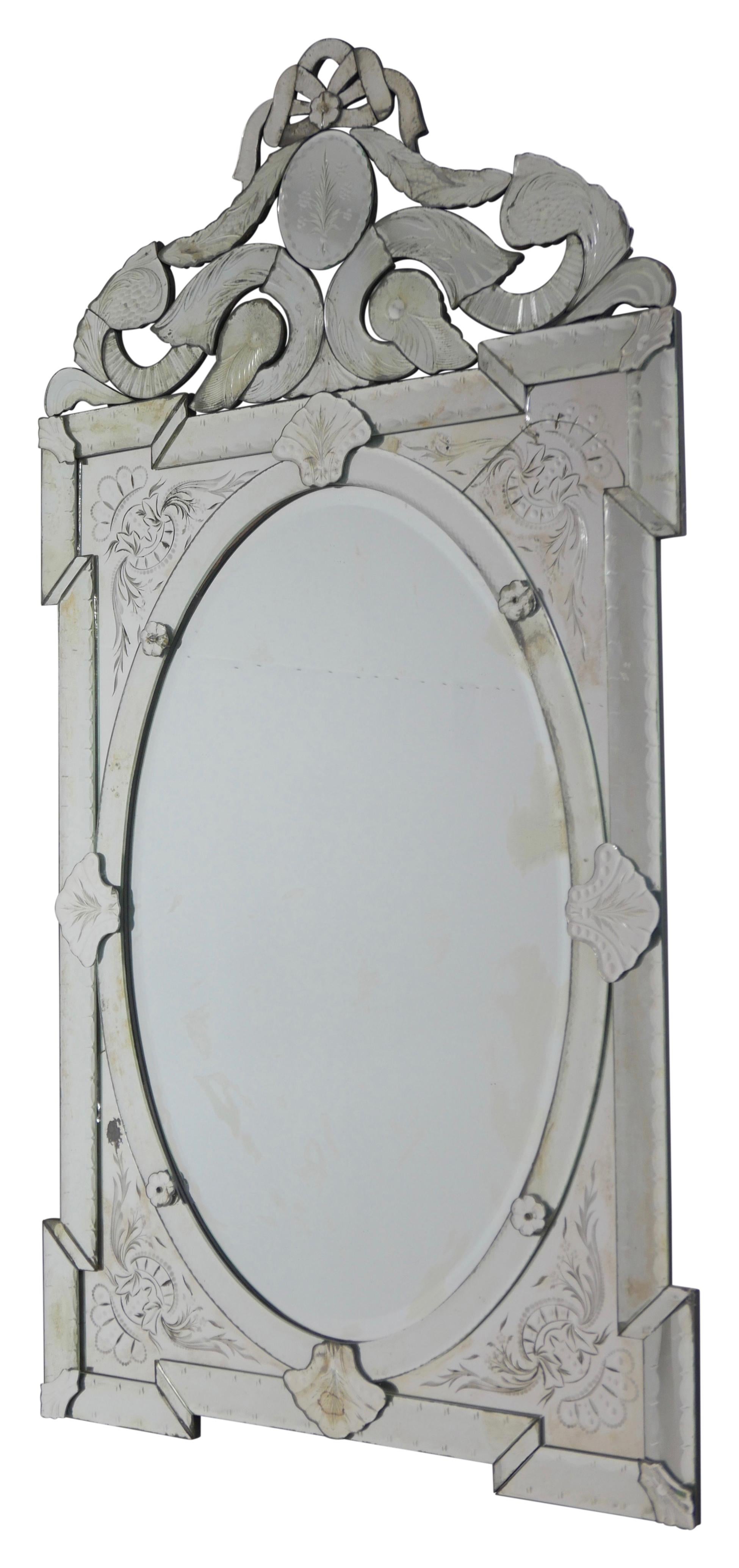 Impressive scale Venetian Pier Mirror with floral and leaf etched panels, very elaborate detailing throughout. Original mirrored panels showing expected signs of age. There are two cracked panels inset Upper Right and inset Lower Left. These could