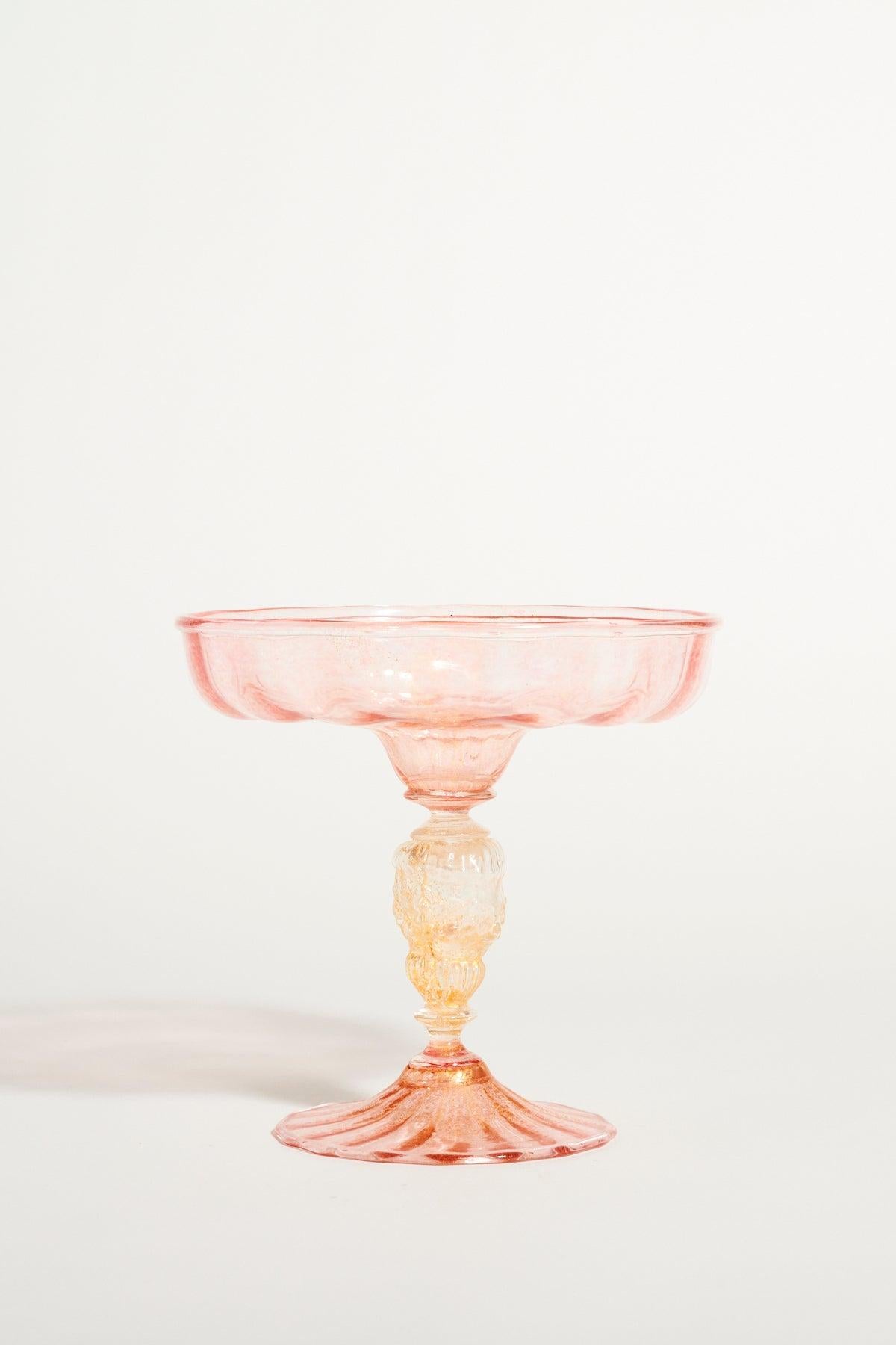 Pretty Venetian glass compote with fluted shallow bowl in pale pink and clear decorative stem flecked with gold.