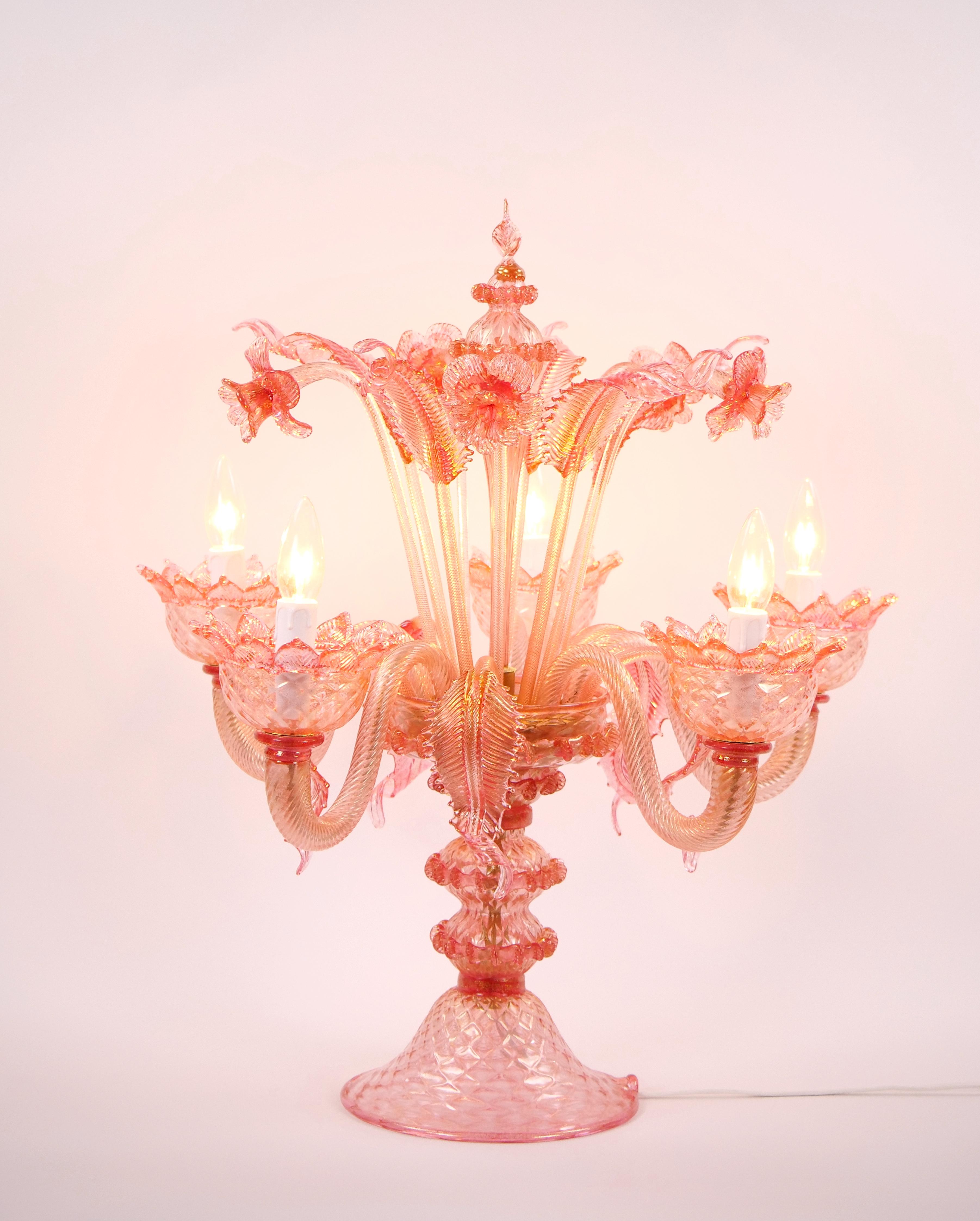 Illuminate your space with the captivating beauty and sublime color of this exquisite handcrafted Venetian table lamp / flambeau, originating from the late 20th century Italy. The lamp is a true work of art, meticulously hand crafted and mouth-blown