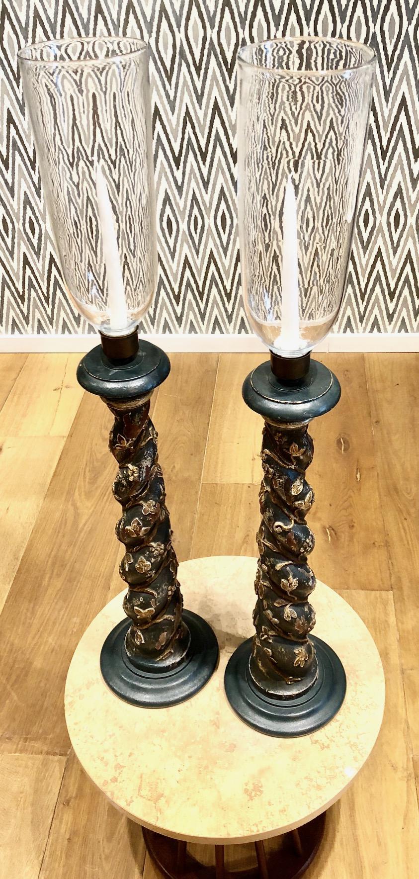 Late 18th century Venetian candleholders, with removable hand blown Hurricane glass cover of exceptional height and scale. Original polychromed decoration
Spiraled wood stem with carved floral and grape vine motifs.