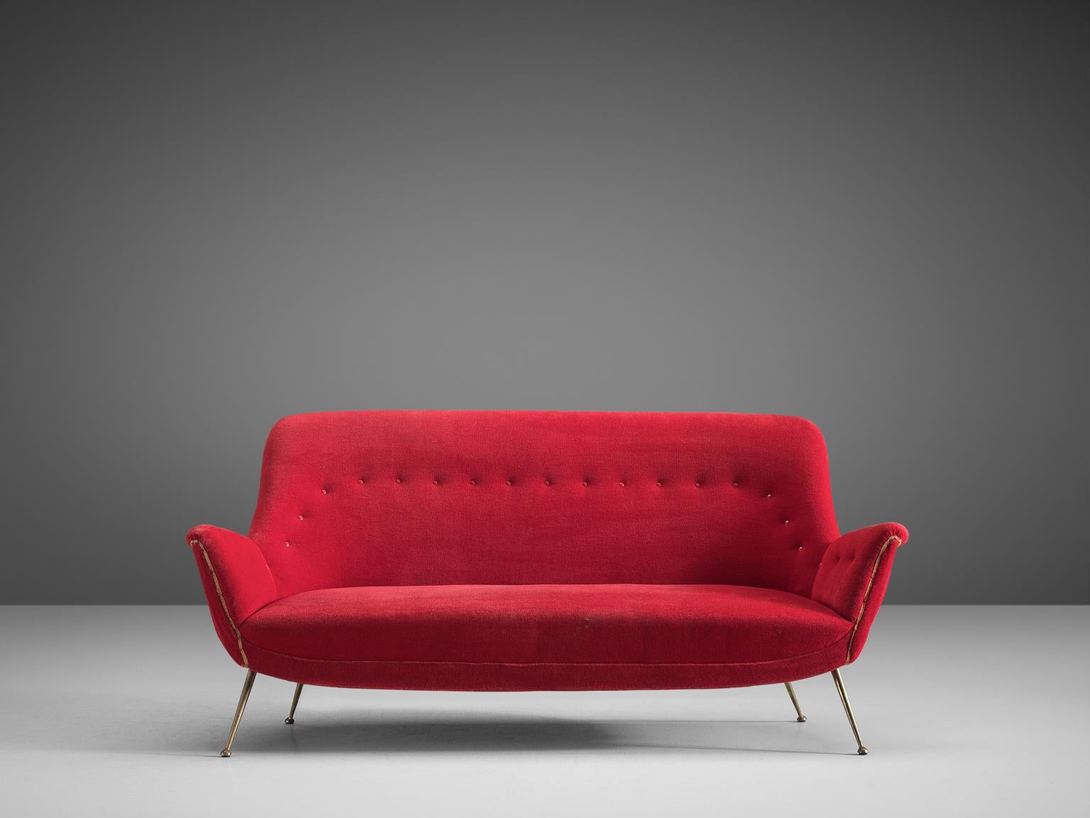 Sofa, red fabric and metal, Italy,1950s.

This gorgeous Venetian sofa is an iconic example of Italian design from the 1950s. Organic and sculptural, this two-and-a-half-seat sofa is anything but minimalistic. Equipped with the original stiletto