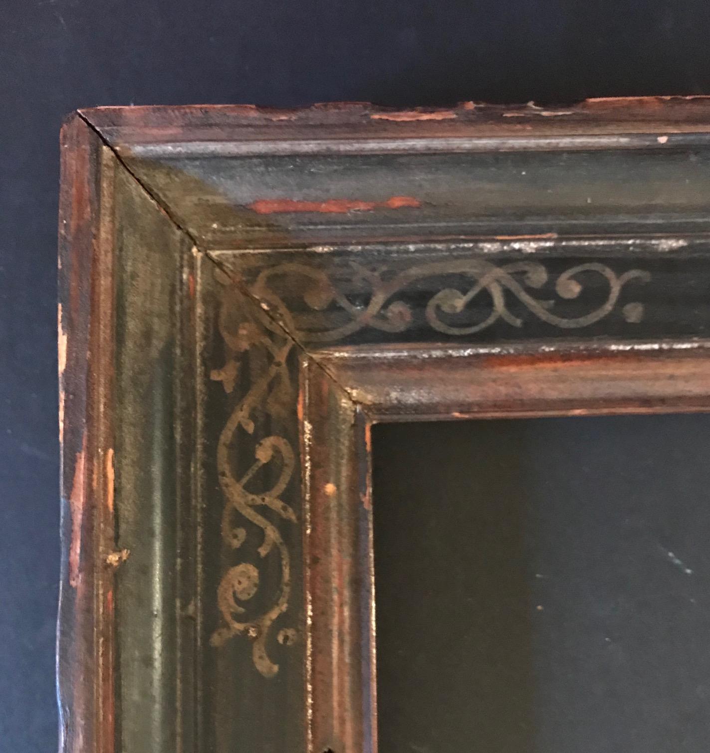 Robert M. Kulicke, the renowned New York Framemaker, created this beautiful Venetian Renaissance style frame. This hand carved cassetta frame is parcel-gilt with a sgraffito border and a delicate arabesque pattern in the frieze. The label, from the