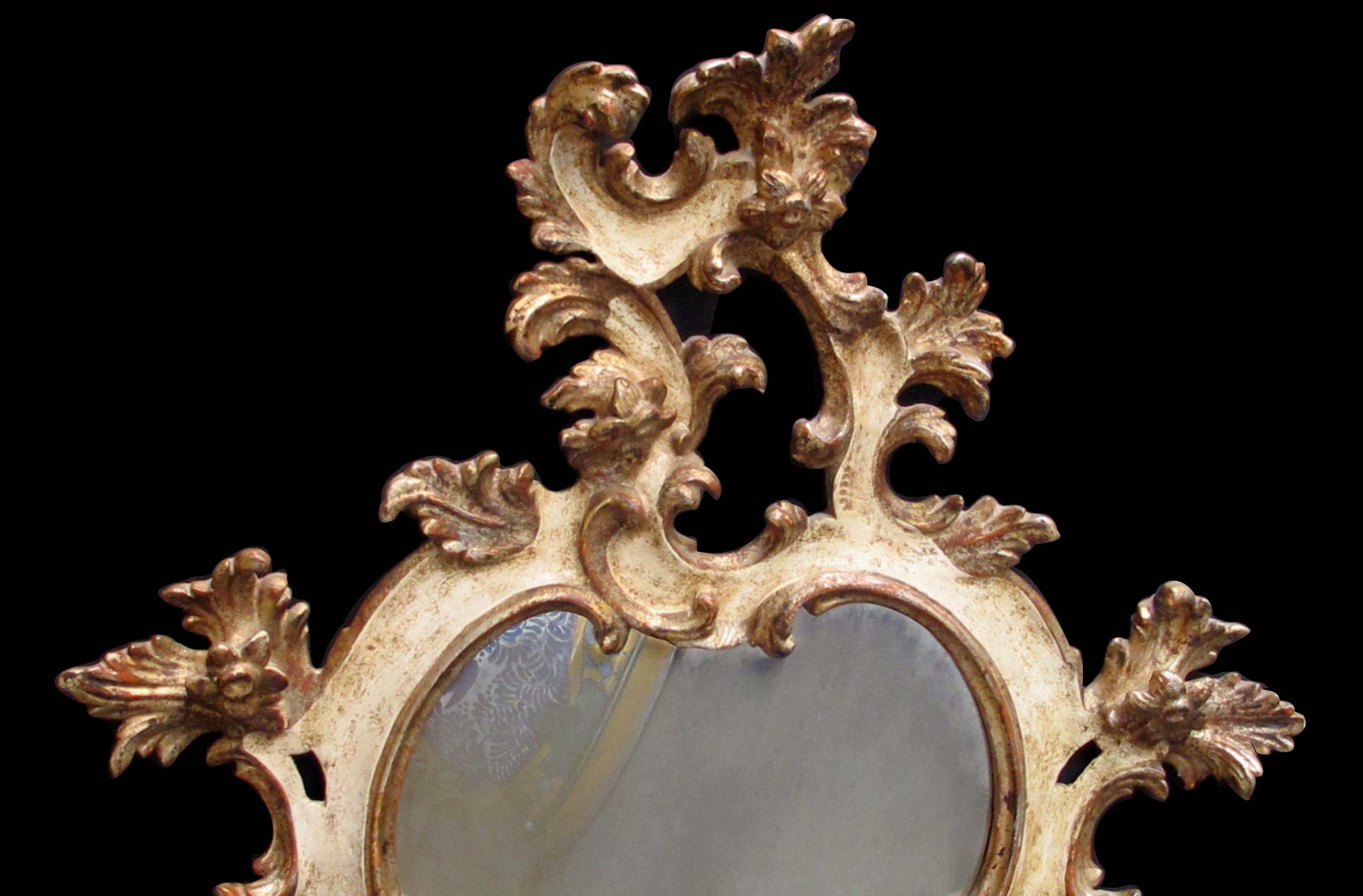 Italian Venetian Rococo Revival Ivory Painted and Parcel-Gilt Cartouche-Shaped Mirror For Sale