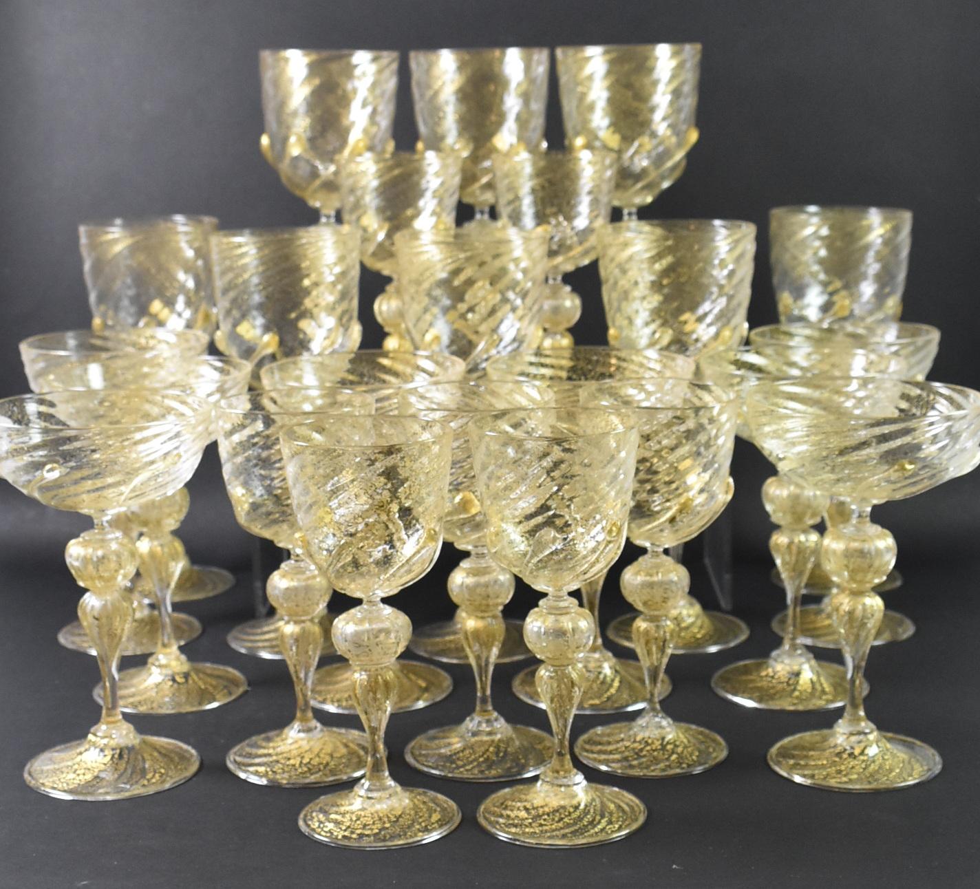 Salviati hand blown Venetian Murano crystal stemware with gold leaf fleck, spiral design, ground and polished pontil, and applied prunts. Set includes 8 goblets (9