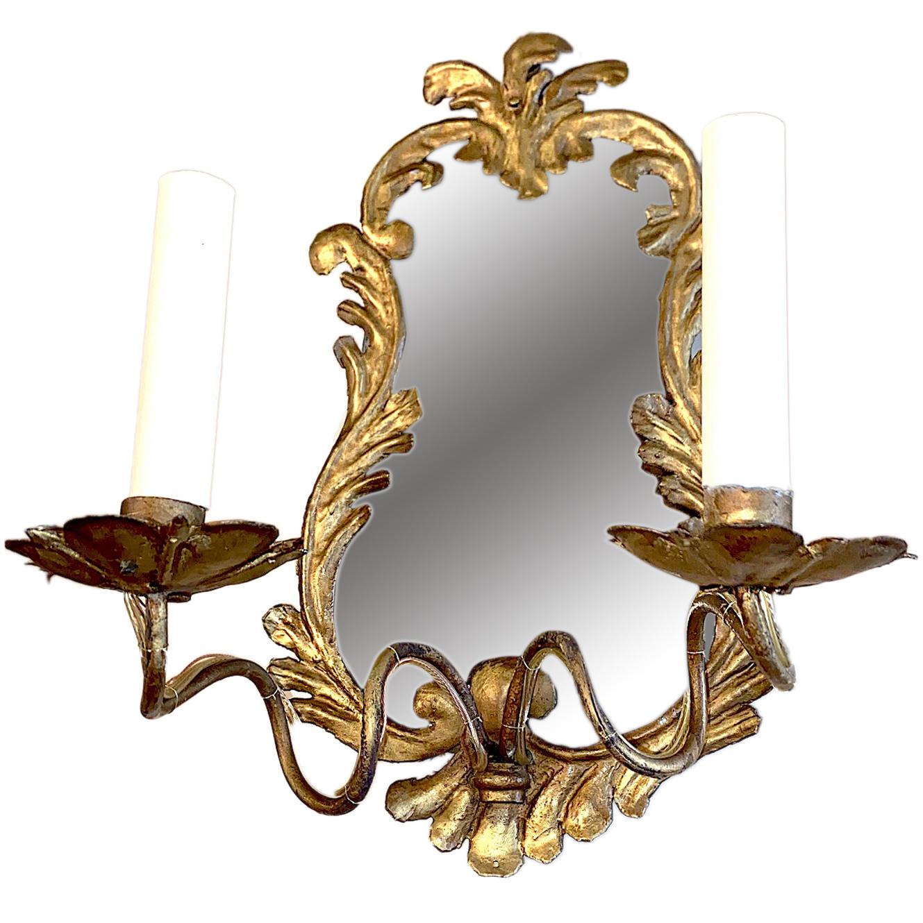 A pair of circa 1920s Venetian double light sconces with mirrored backplate.

Measurements:
Height 15.5