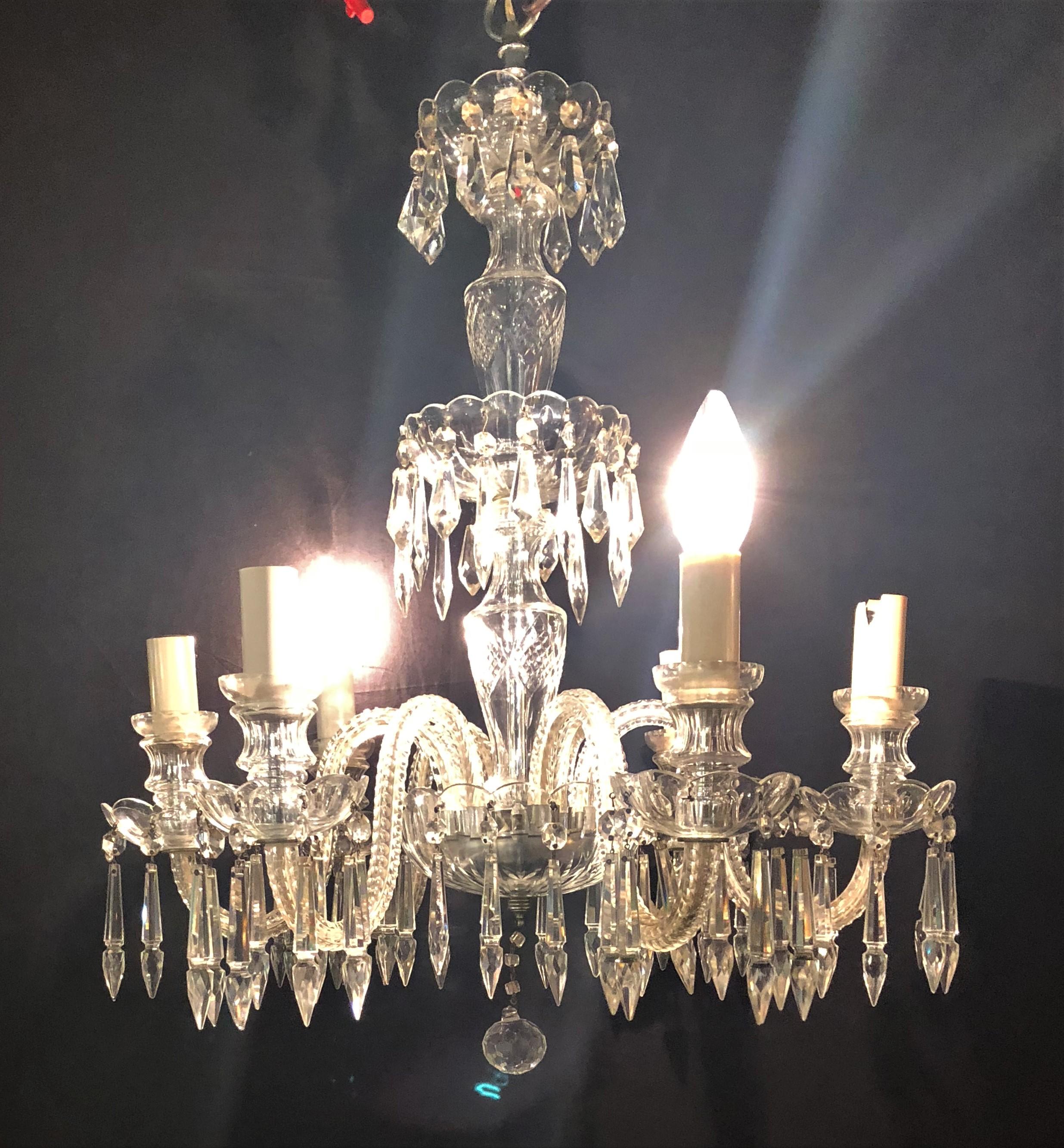 A Venetian six-light cut crystal chandelier, circa 1920. The center column having six cut arms flowing with crystal drops. The center column with hanging tier crystals.