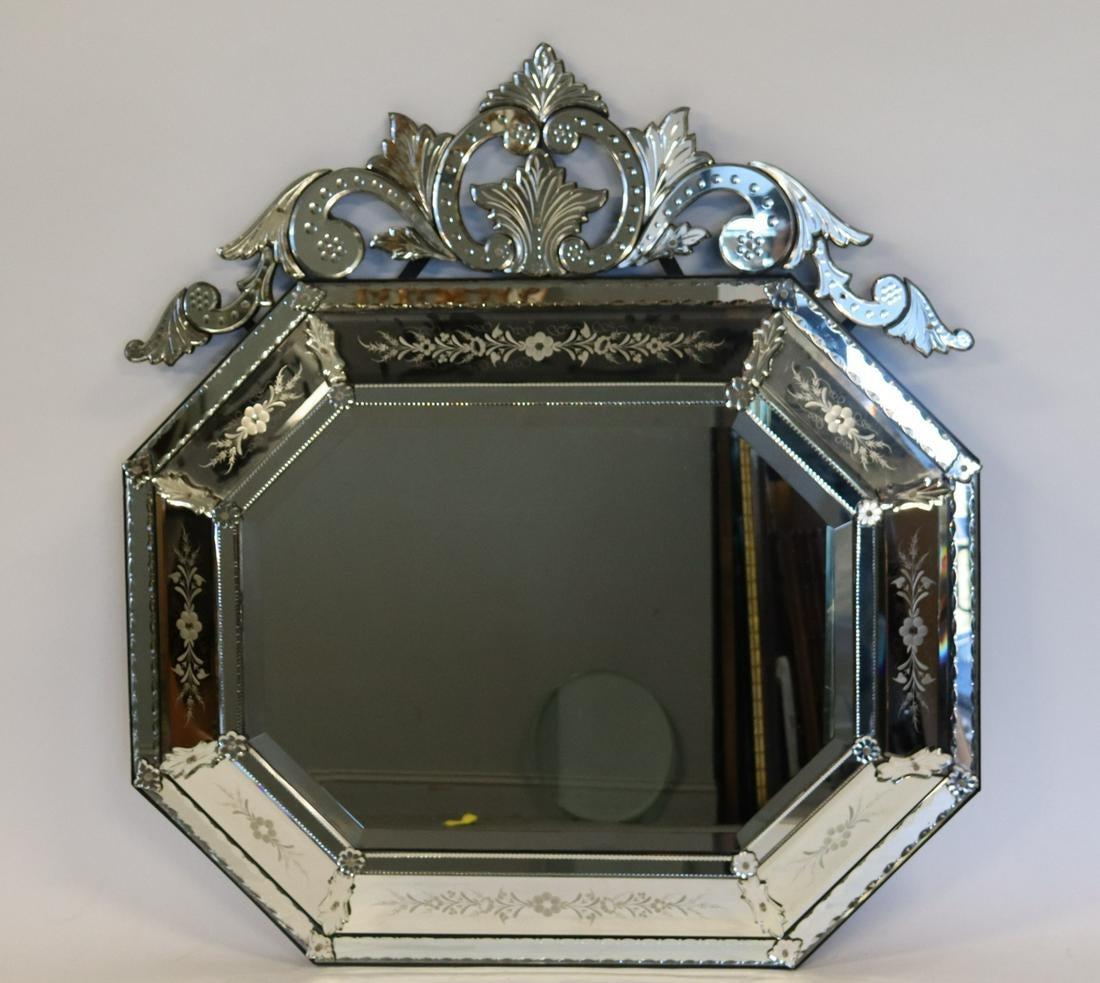 Venetian style beveled wall mirror with floral etched glass. This magnificent over the mantle, console, pier or wall mirror is simply stunning. The beveled center panel is clean and sharp set in an octagonal border of etched glass mirror design. The
