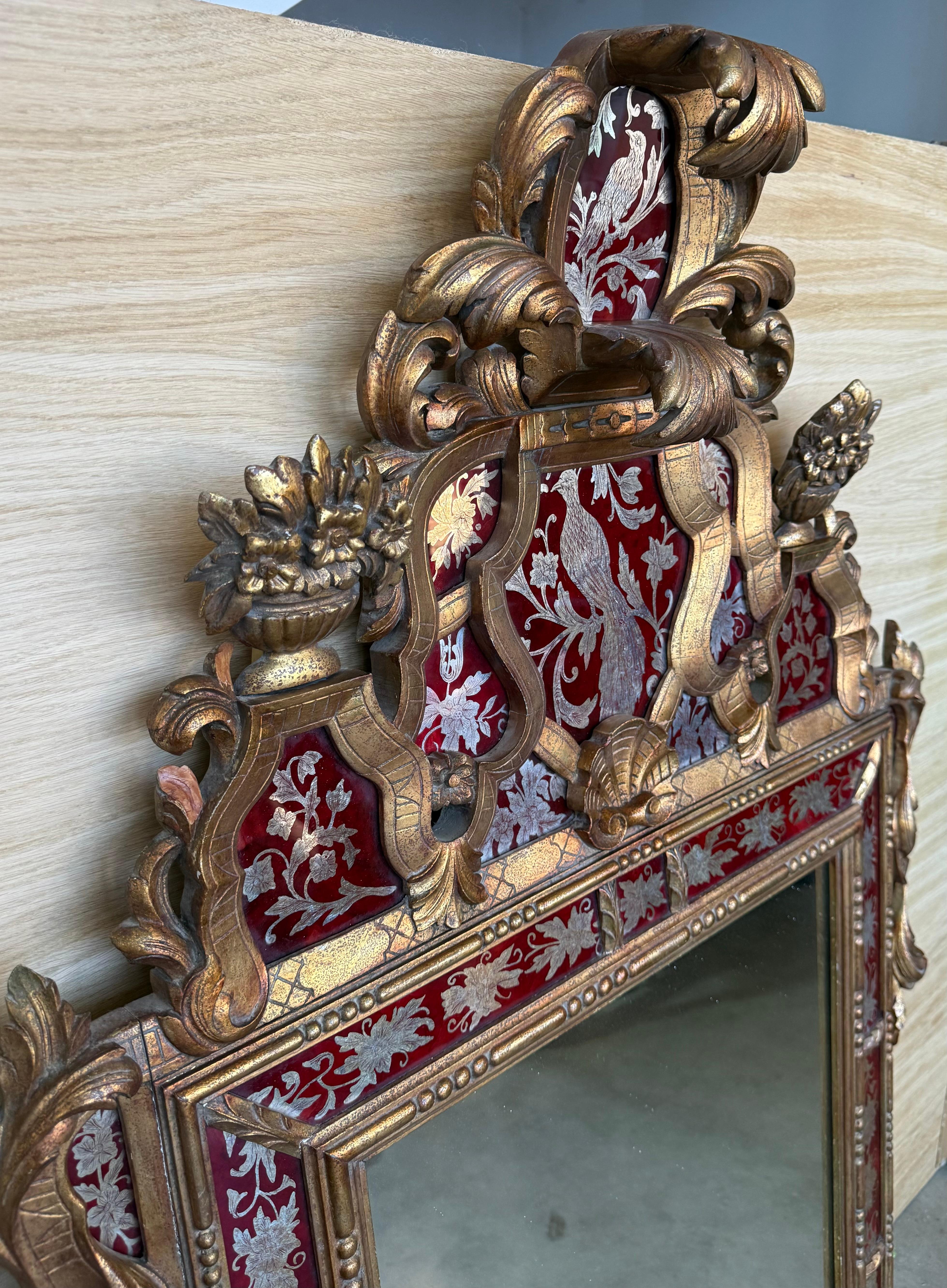 Italiano Venetian Style Carved Wood Gilted Mirror with Red Glass Border in vendita