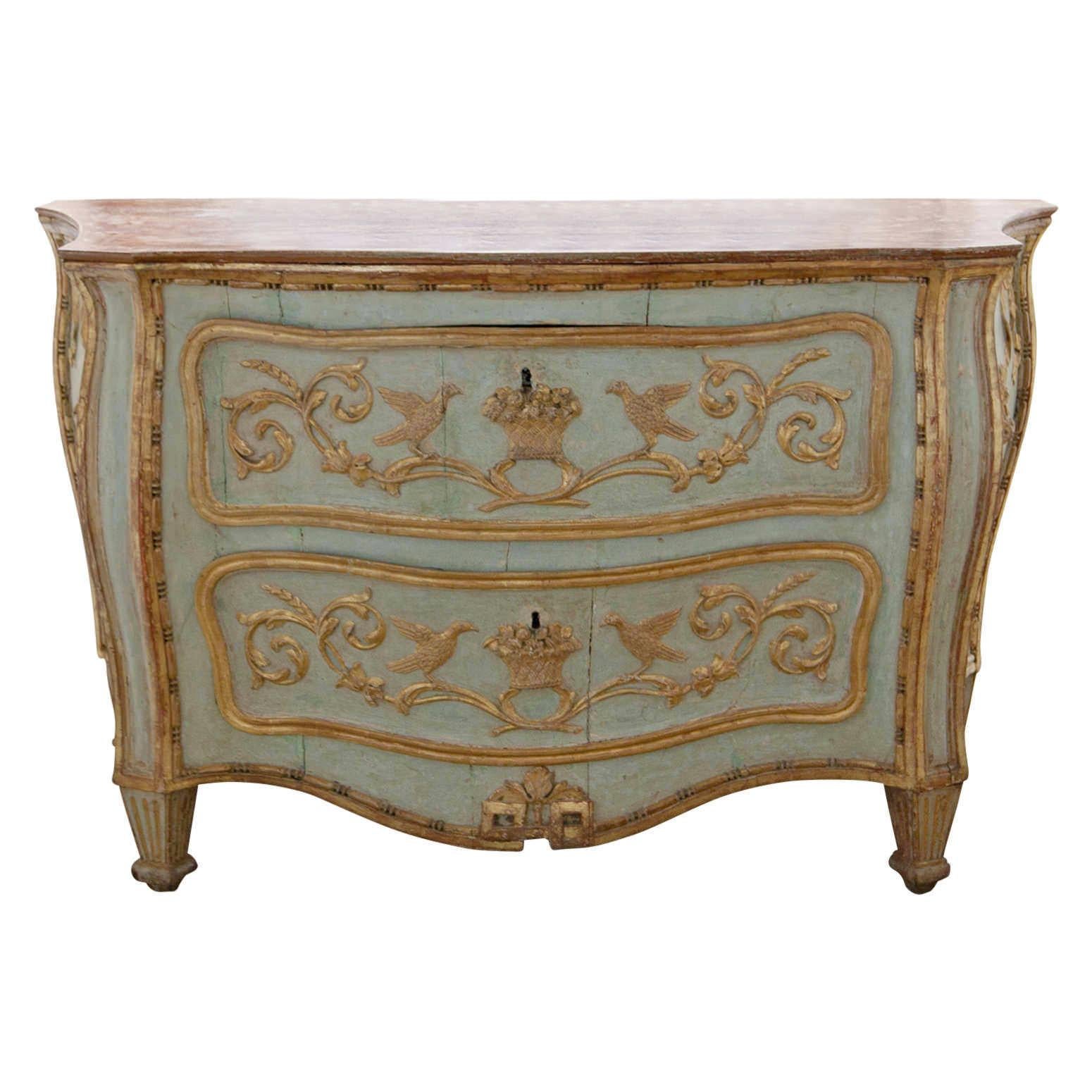 Two-drawered Venetian-style painted chest of drawers of the 18th century. The trapezoidal body stands on short fluted feet and used to be opened from the sides. These doors were sealed off and two drawers were integrated in the front. The chest is