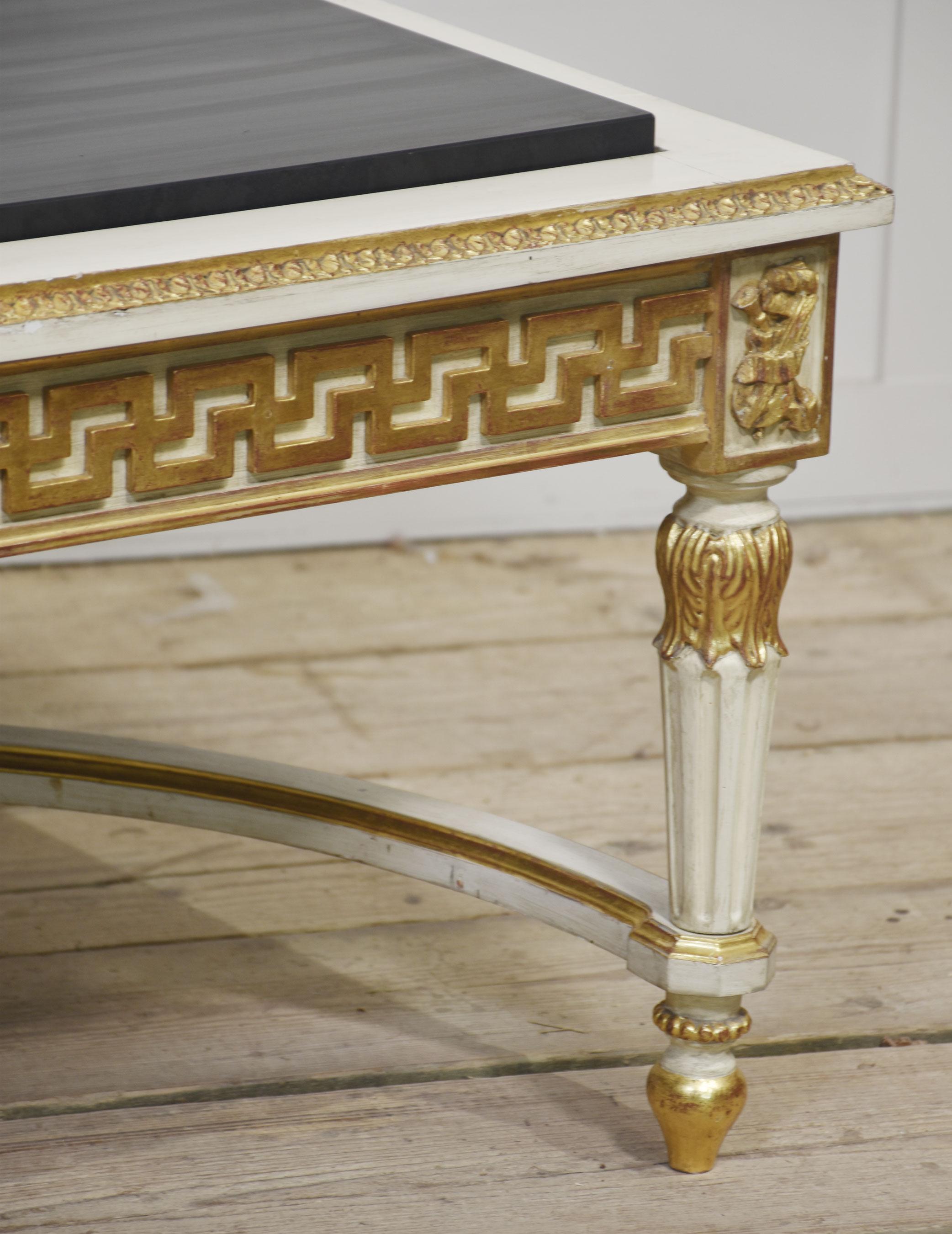 Venetian style coffee table, the large rectangular black veined marble top above cream and gilt painted base. All raised up on turned reeded tapering legs, united by curved stretchers.
Dimensions
Height 19 Inches
Width 53 Inches
Depth 39.5 Inches