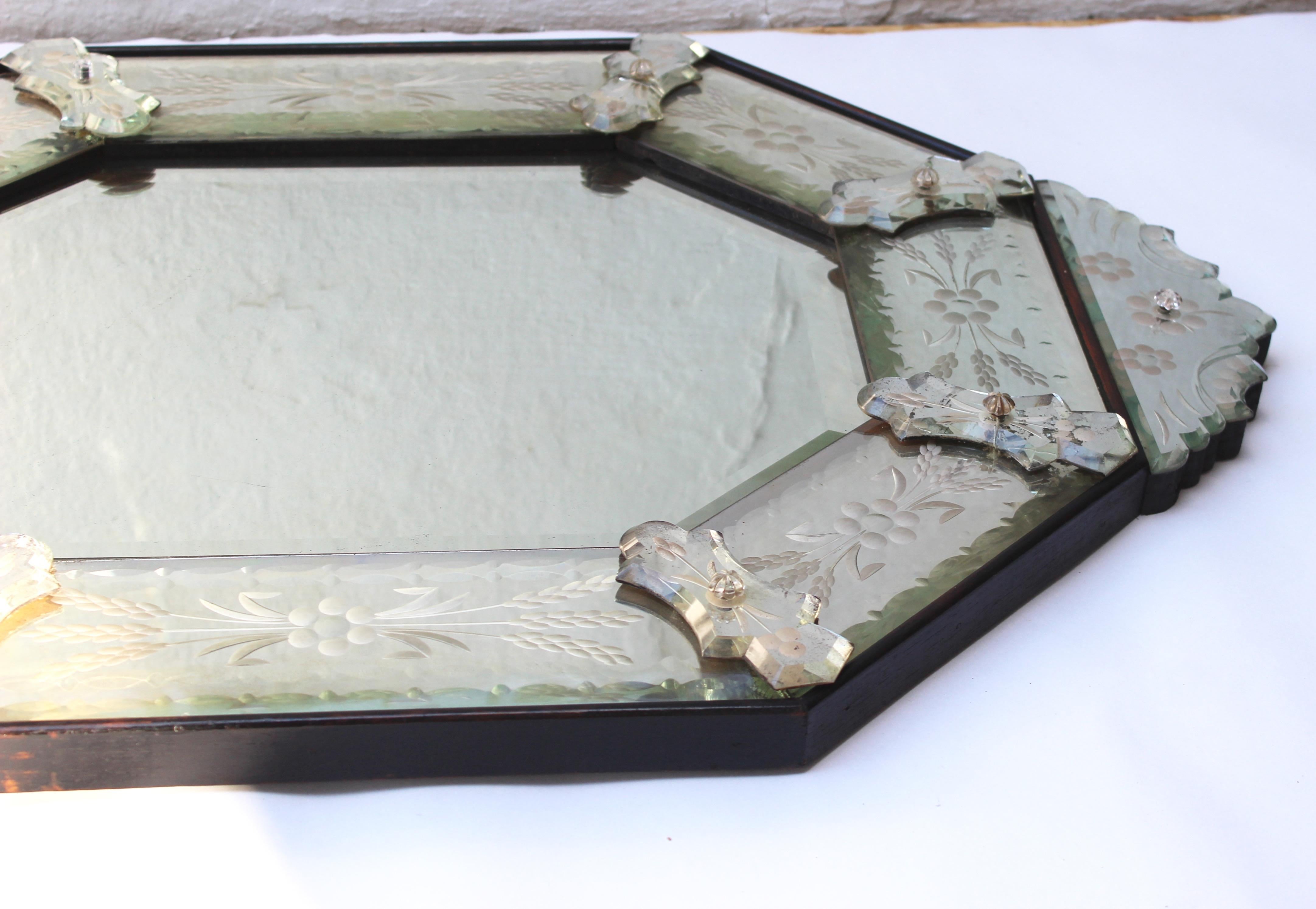Venetian style etched glass mirror.
