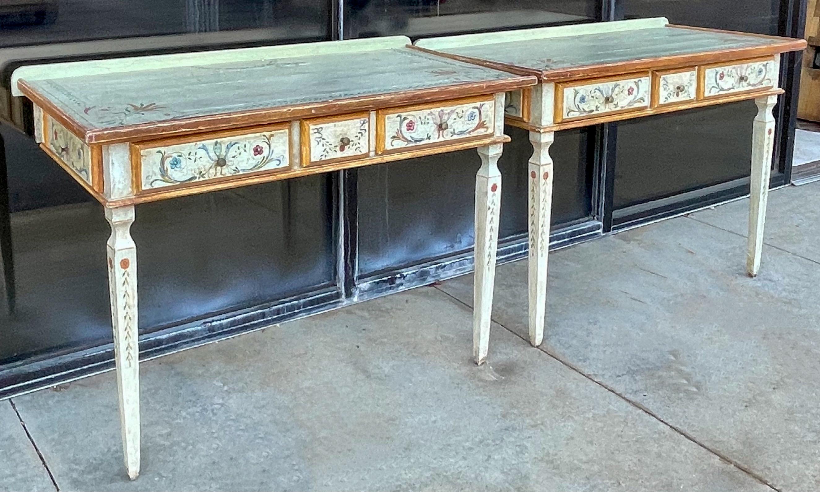This is a pair of Venetian style hand painted console tables or desks by Niermann Weeks. They are marked and have some intentional distressing. Note the paper lined drawers! From bedside to foyer, these provide many options.