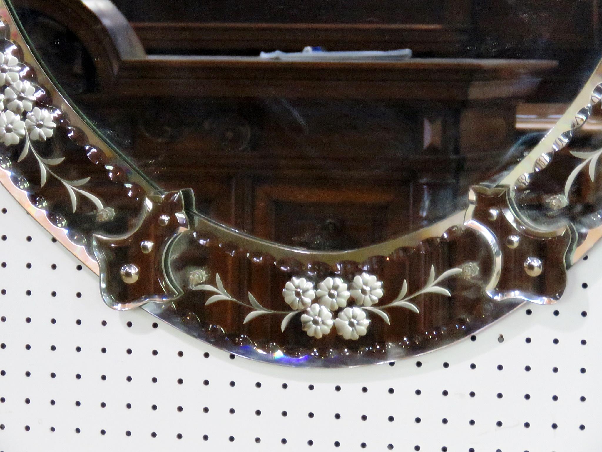 Venetian style mirror with églomisé floral design.