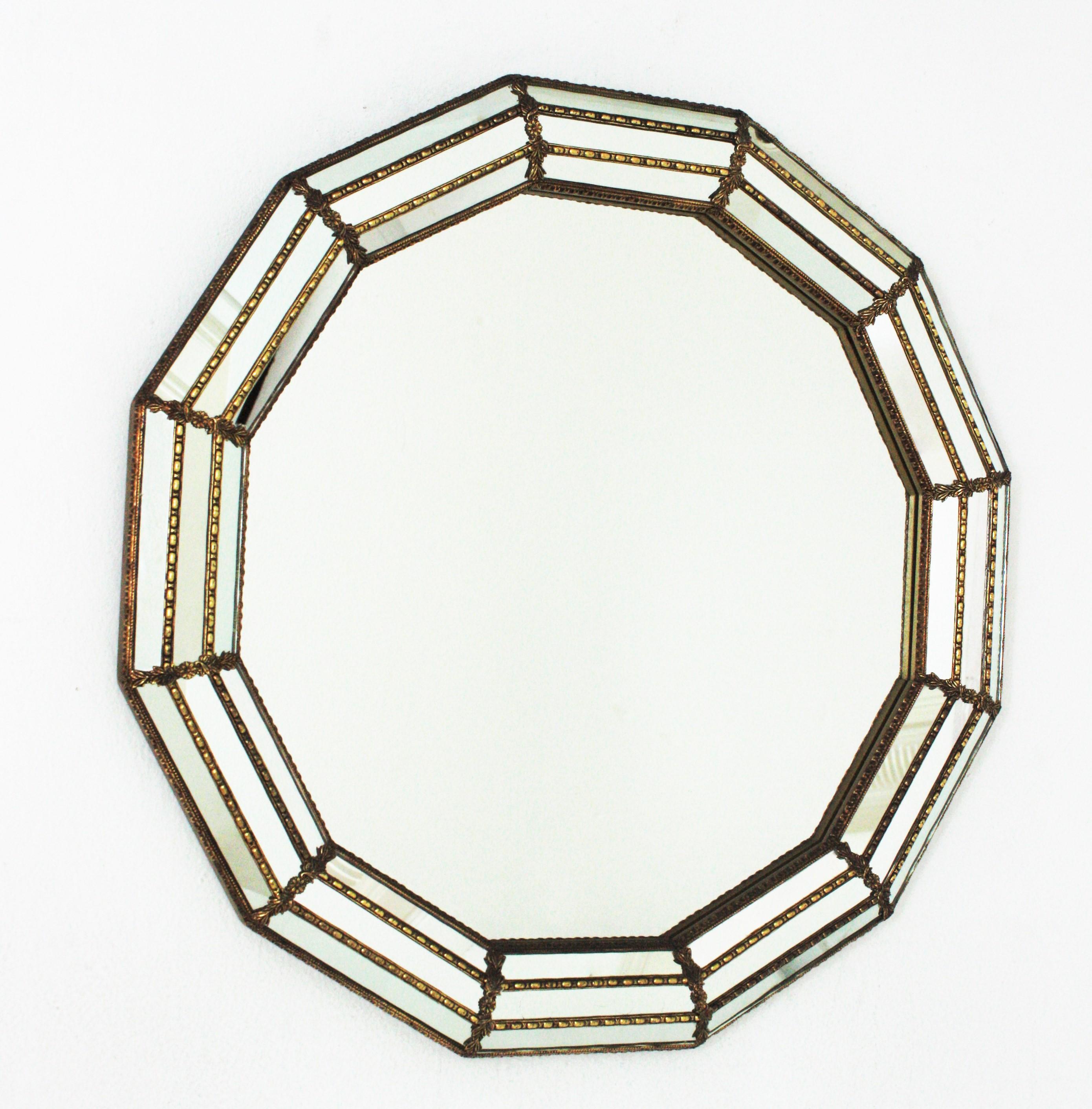 Venetian style 12-sided wall mirror with gilt metal accents, Spain, 1950s
This eye-catching dodecagon mirror has a triple mirror frame. The mirrored panels are adorned by metal patterns and flowers.
This wall mirror will be perfect in a contemporary
