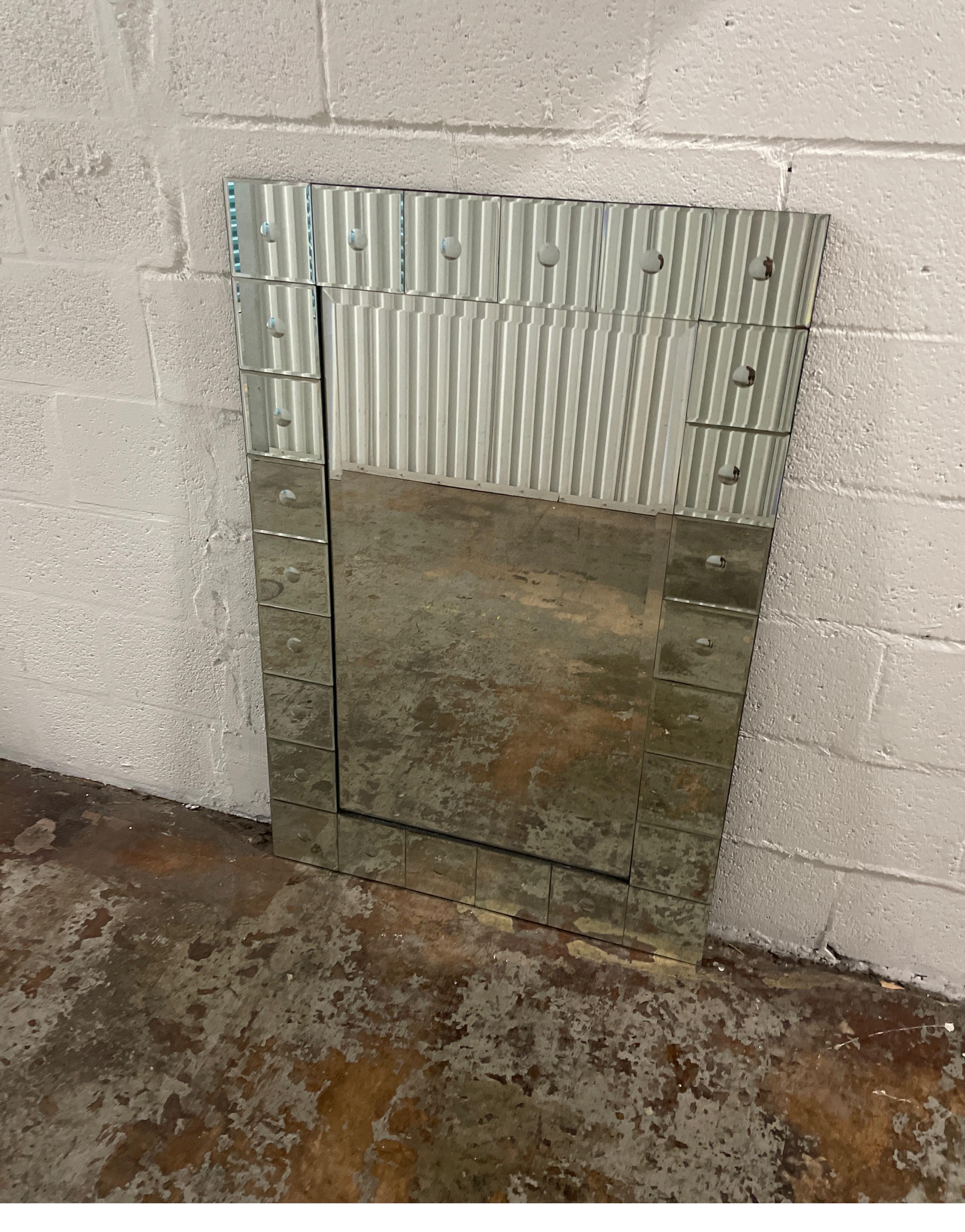 Large Venetian style mirror with square mirrored border.