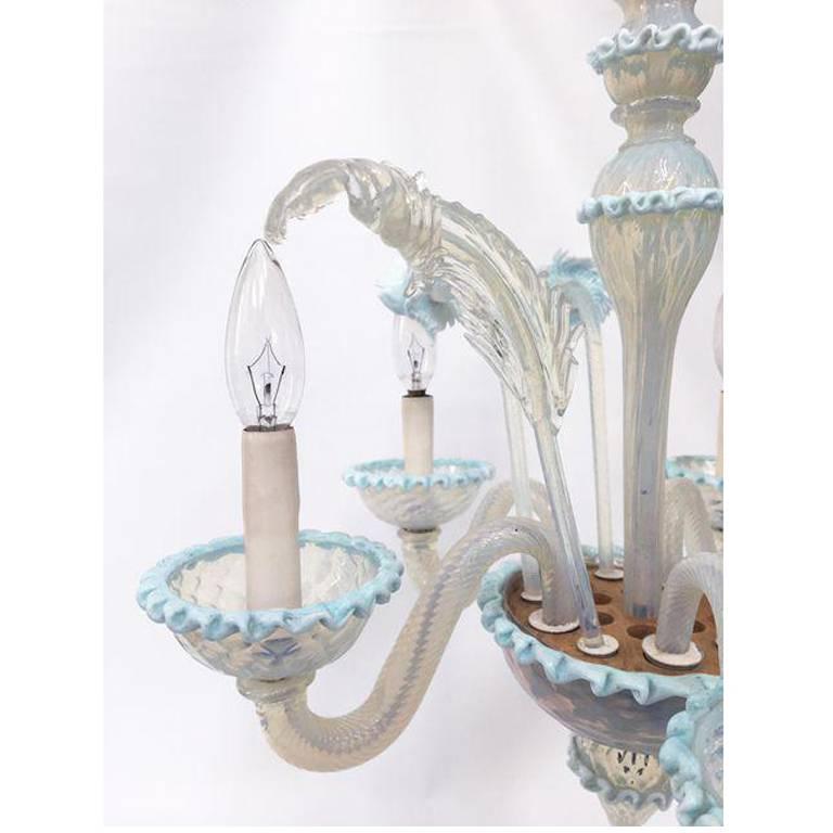 Vintage Murano five-light chandelier in pale blue and clear glass. 
Features handblown glass flowers in soft blue hues.
Excellent vintage condition. 
A few tiny points are chipped (see last photo).