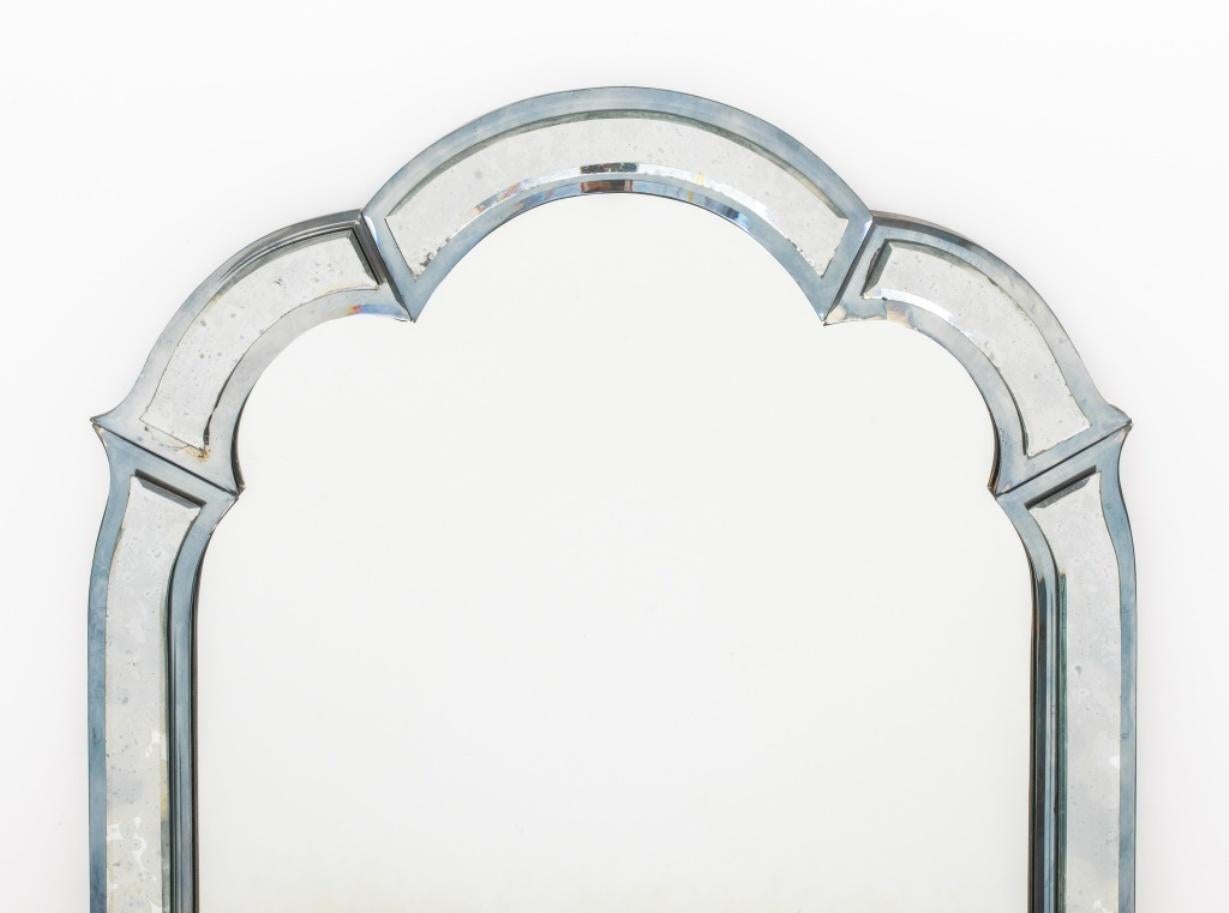 Venetian style pier mirror, 1960s or later, with shaped top and sides composed of six beveled panels centering a rectangular Mirror plate. Measures: 50