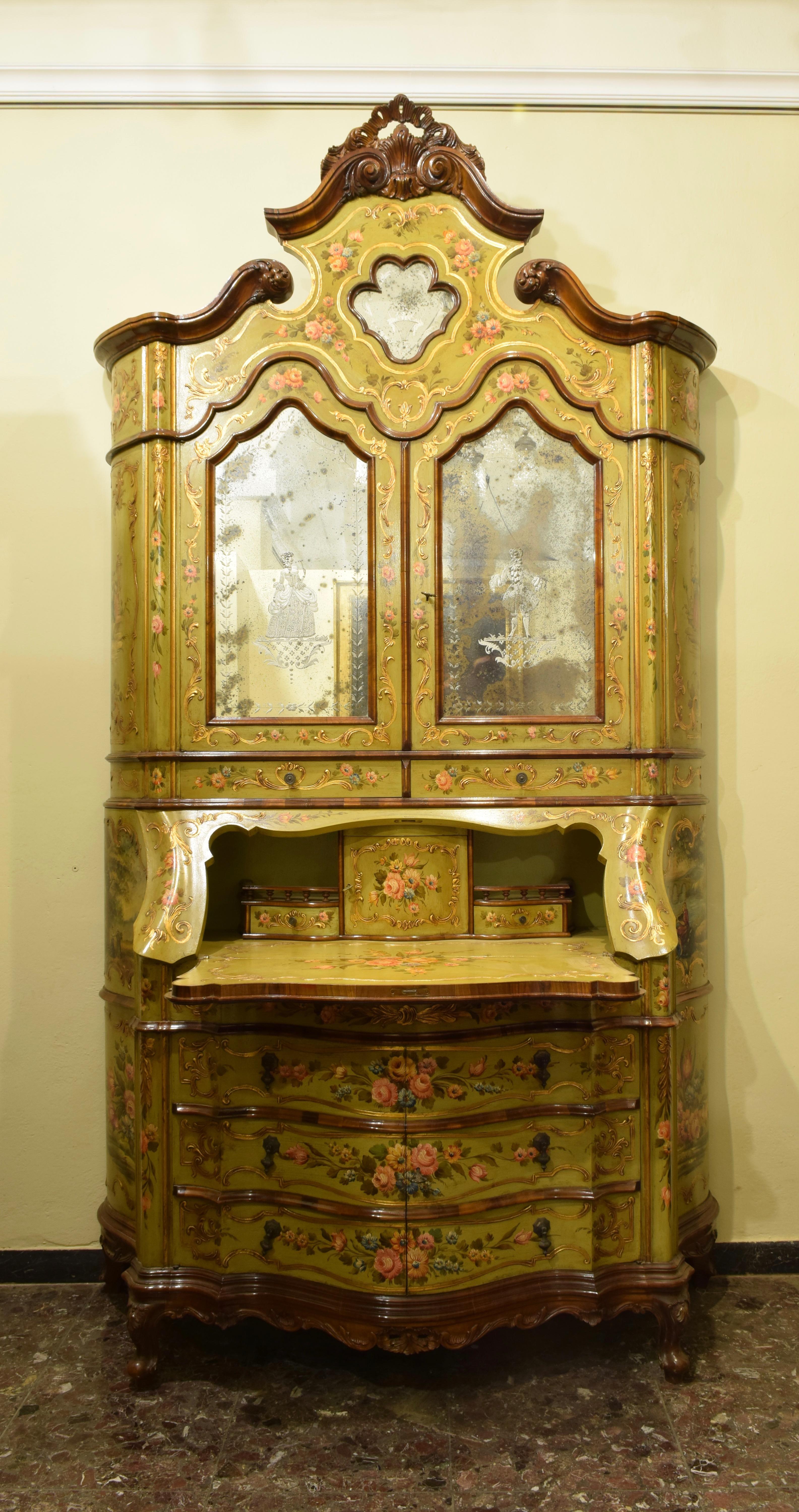 Venezia, Italy, handcrafted production from 1976
In Venetian style Louis XV
Painted and decorated in gold
Upper part with two doors with two beveled mirrors depicting a Lady and a Gentleman. Inside a door and two drawers.
In the lower part there