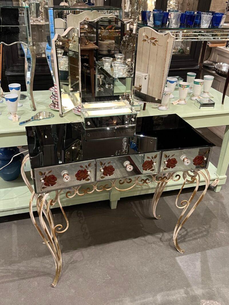 Elegant French Venetian dressing table in classic and sophisticated craftsmanship, from France around 1920 – 1940.

This eye catching piece table consists of faceted mirror glass on all fronts and a black opal glass table top, which creates a