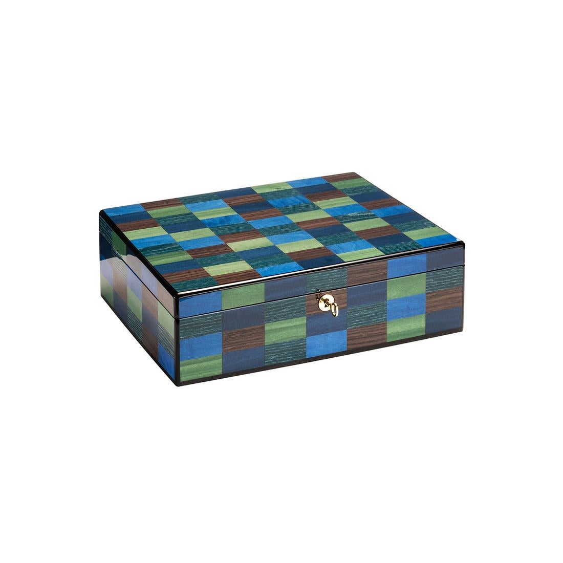 A splendid piece of functional decor fit for a private office or studio, this watch case is distinguished by an exquisite handmade inlay work of a series of colorful rectangles of modern inspiration. Enriched with gold-finished metal details, it is
