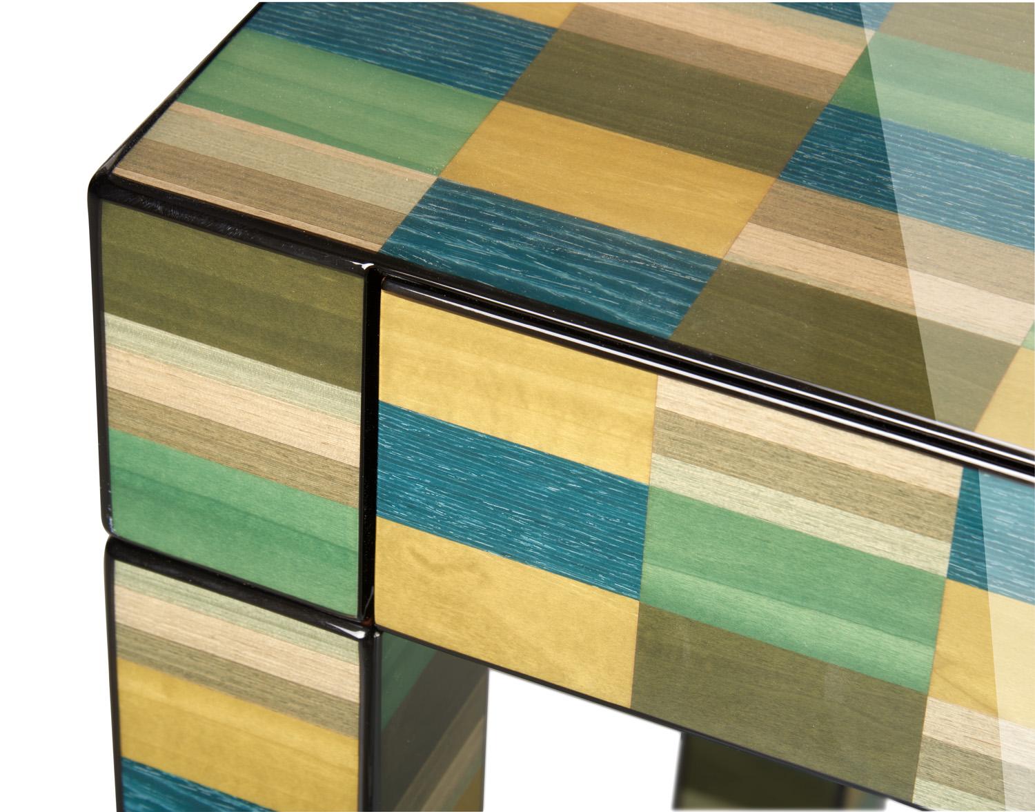 A superlative showcase of craftsmanship paying tribute to modern art, this coffee table will create a bold and captivating focal point in any contemporary or eclectic interior. Entirely handcrafted of wood, it is characterized by a geometric motif