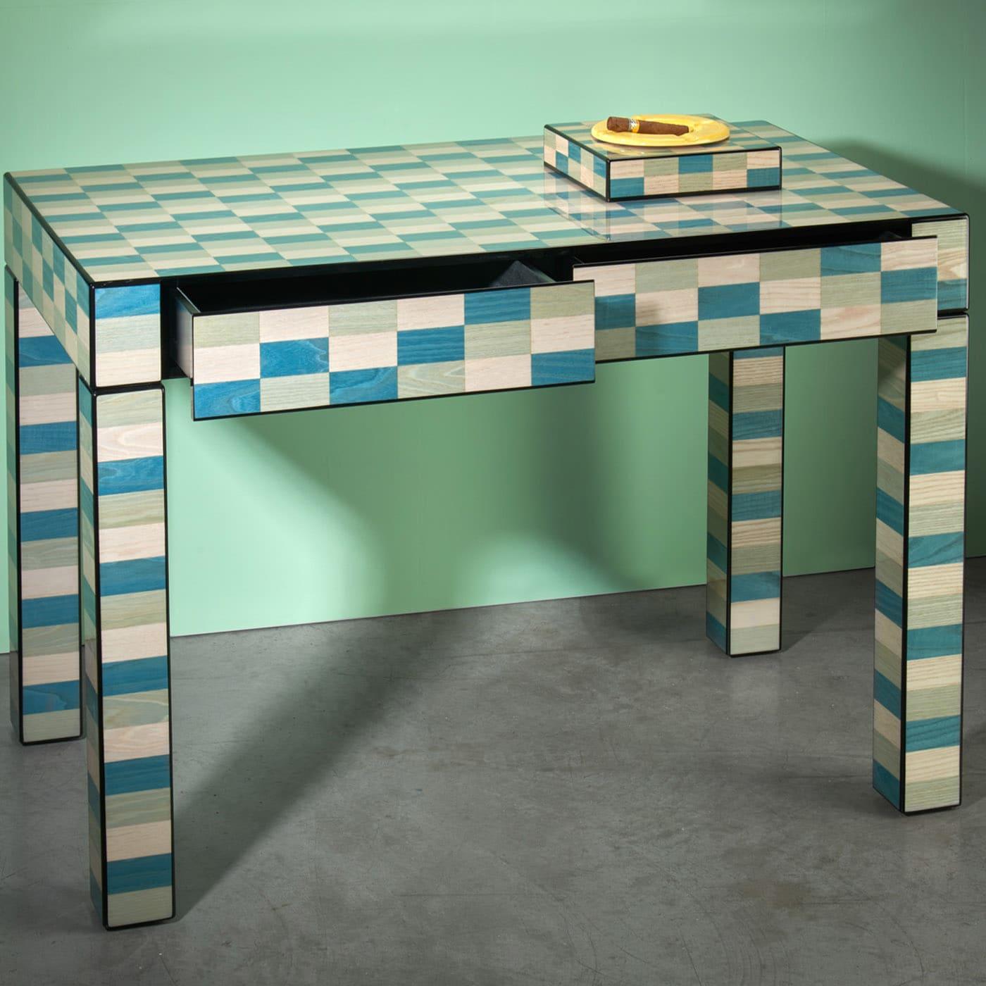 Showcasing natural grains through the polished and mirror-brushed finishes of the rectangular wooden shape, this writing desk boasts a handmade inlay work painted by hand in a delicate palette inspired by the colors of the Venice Lagoon. It features