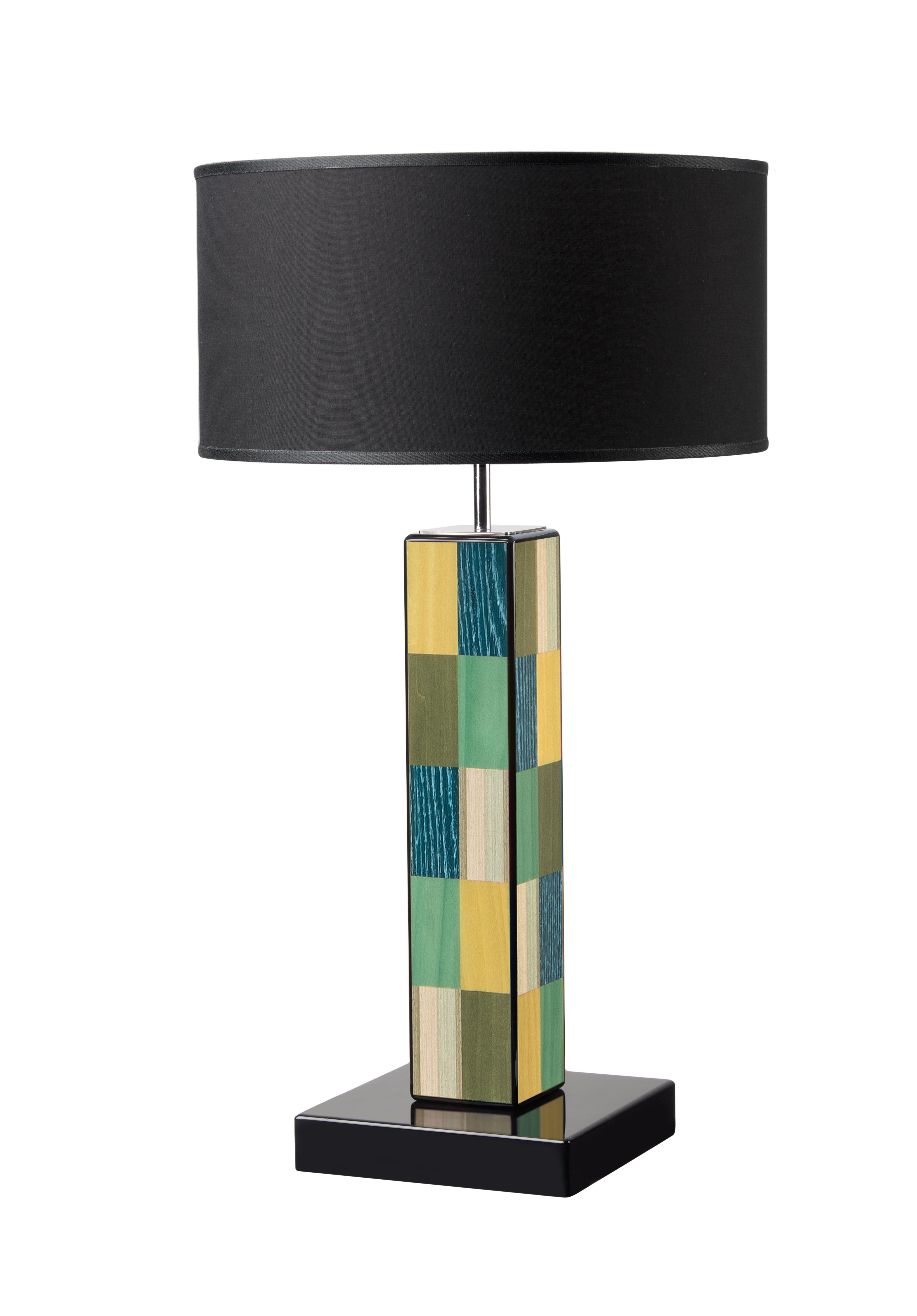 Exquisitely balanced like a modern art painting, this table lamp is composed of sleek, geometric lines with bold visual appeal. Handcrafted of wood polished and brushed by hand, and enriched with handmade inlay works of green, blue, and