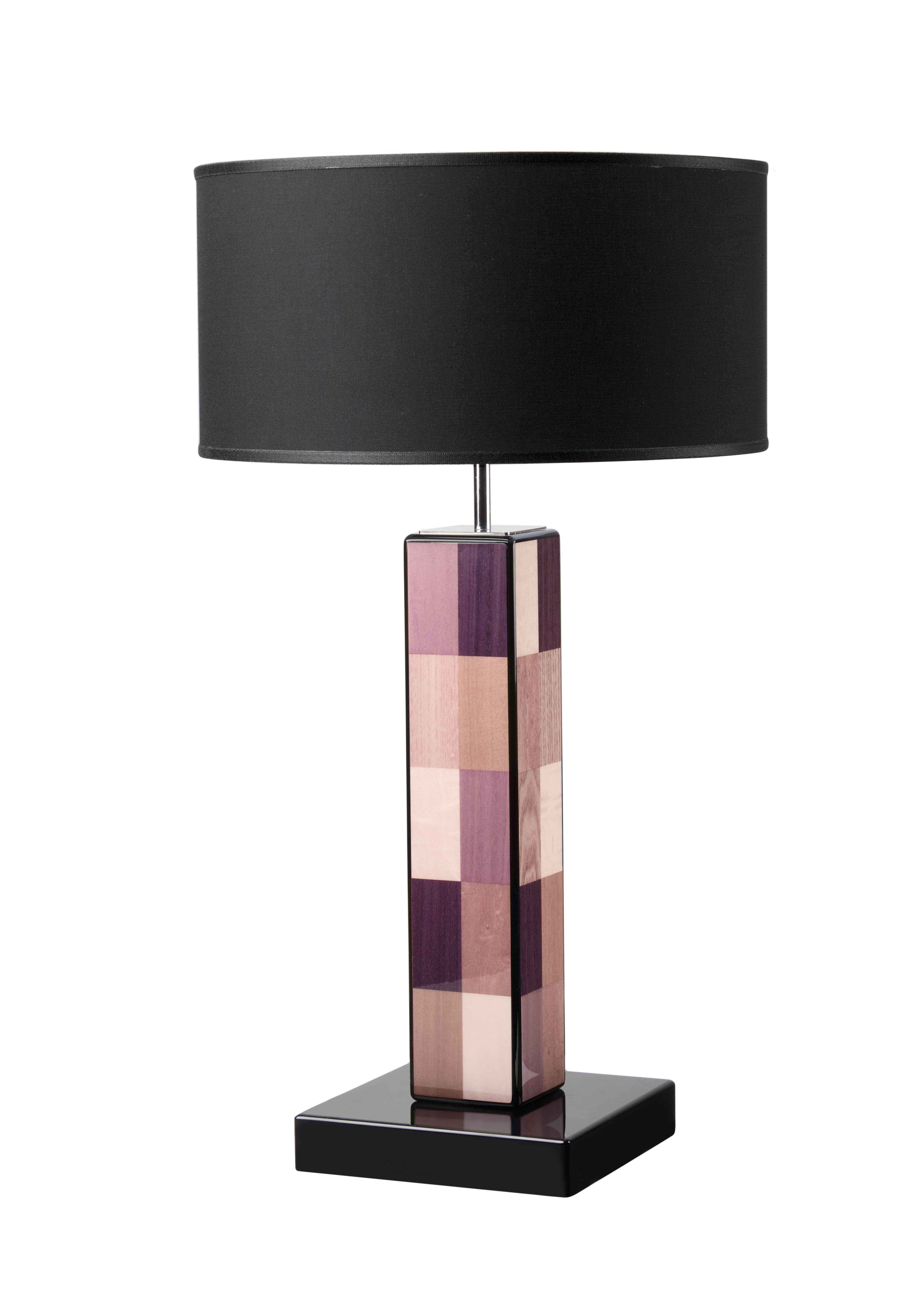 Clean and essential geometric lines define this spectacular table lamp, making it a stately piece of refined sophistication. Masterfully handcrafted, it is characterized by a handmade inlaid veneering with pastel pink, beige, and brown rectangles