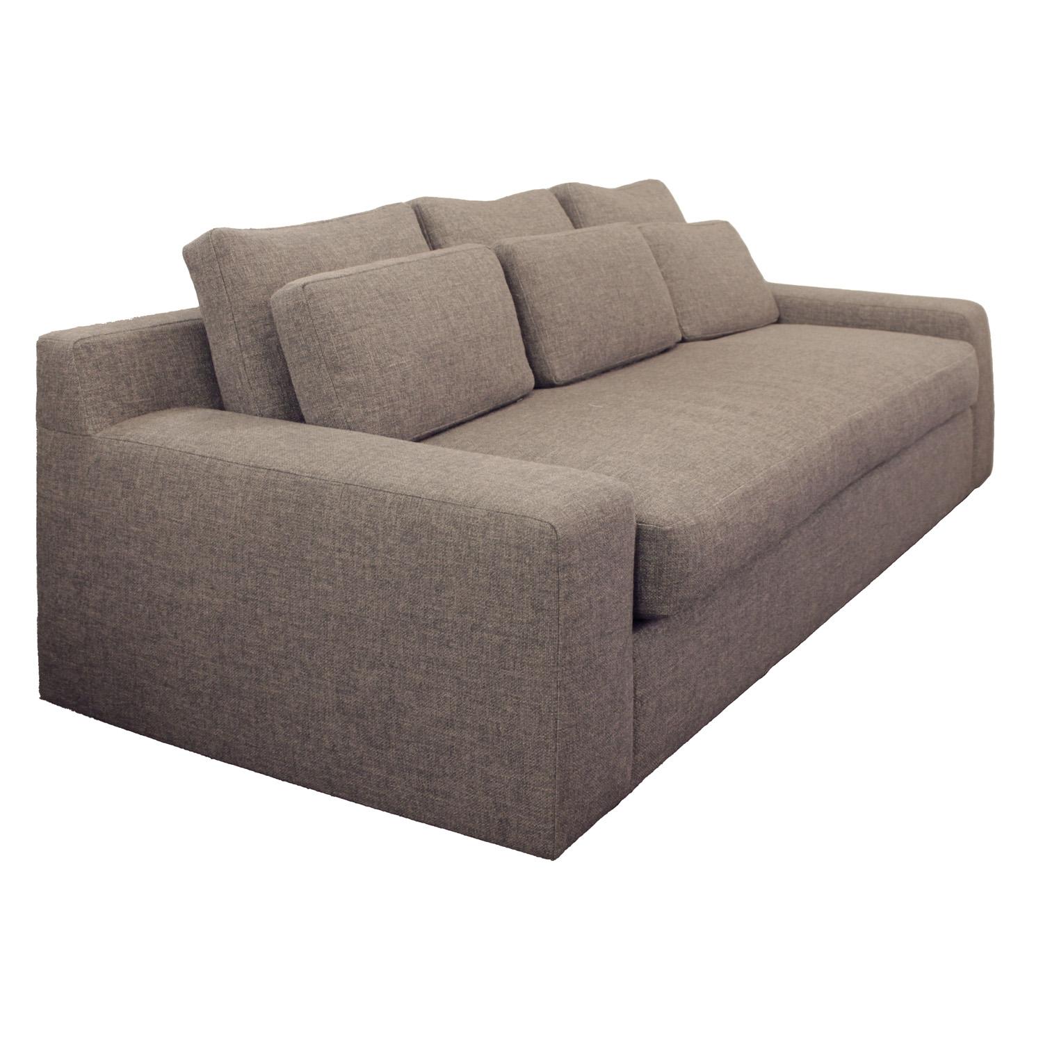 Stylish Modern sofa with 6 back pillows and low, wide arms. This sofa's deep single seat cushion is perfectly sized to serve as a daybed or single bed for the occasional overnight guest. Newly upholstered in stone gray Holly Hunt high performance