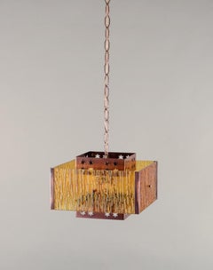 Venhola, Finland. Ceiling lamp in brass and amber-colored glass. Finnish design.