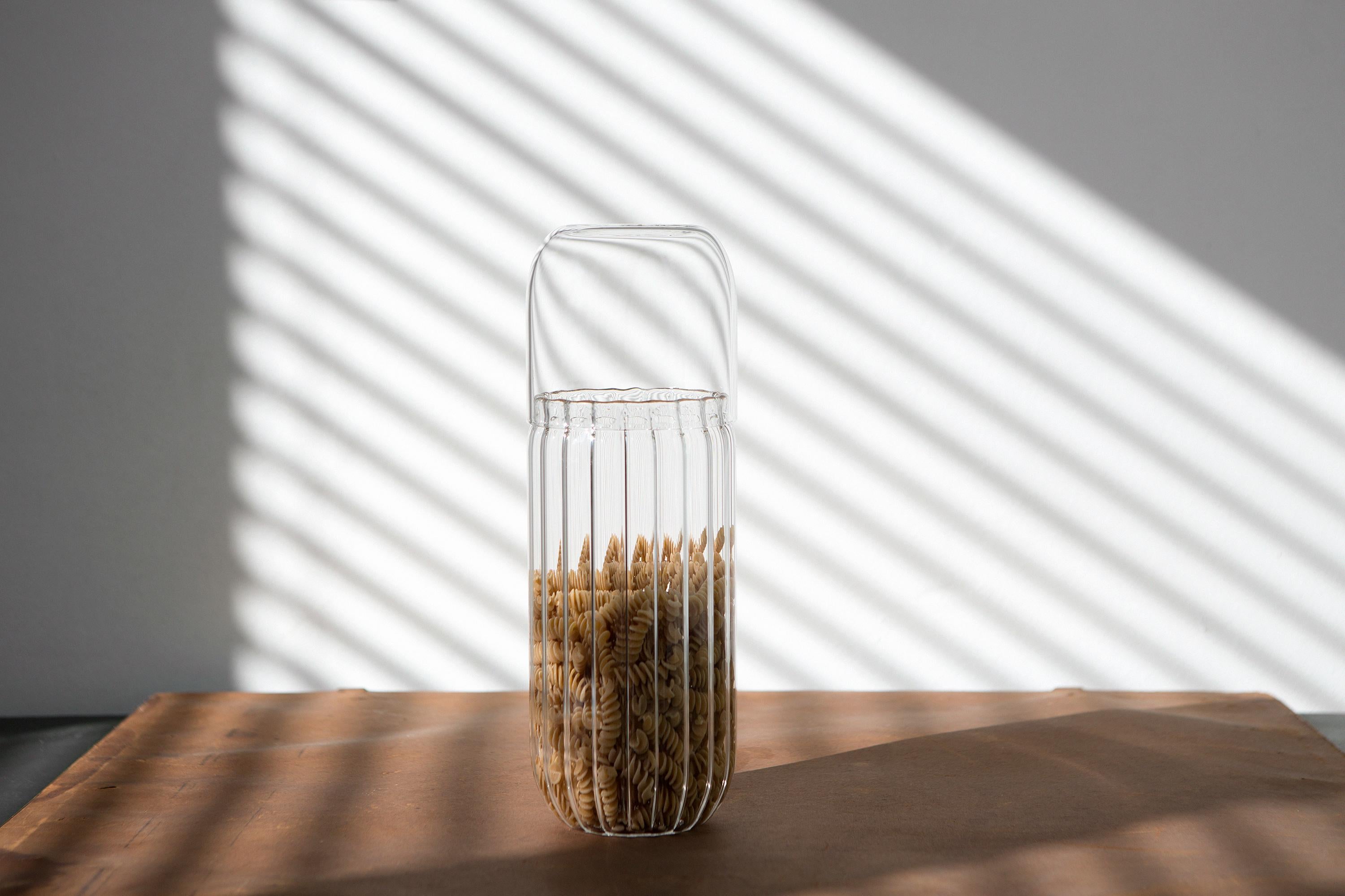 Innesti L is a container in borosilicate glass masterfully blown in Venice by Soffieria for Hands on Design. Designed by GumDesign this piece is characterized by the contrast between striped glass of the bottom and the smooth finish of the top; this