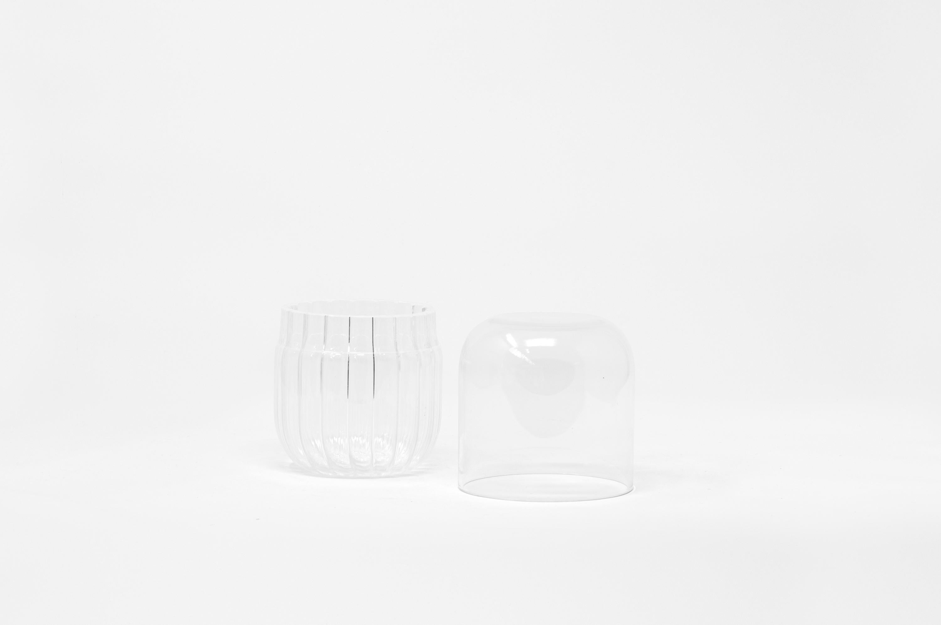 Innesti S is a container in borosilicate glass masterfully blown in Venice by Soffieria for Hands on Design. Designed by GumDesign this piece is characterized by the contrast between striped glass of the bottom and the smooth finish of the top; this