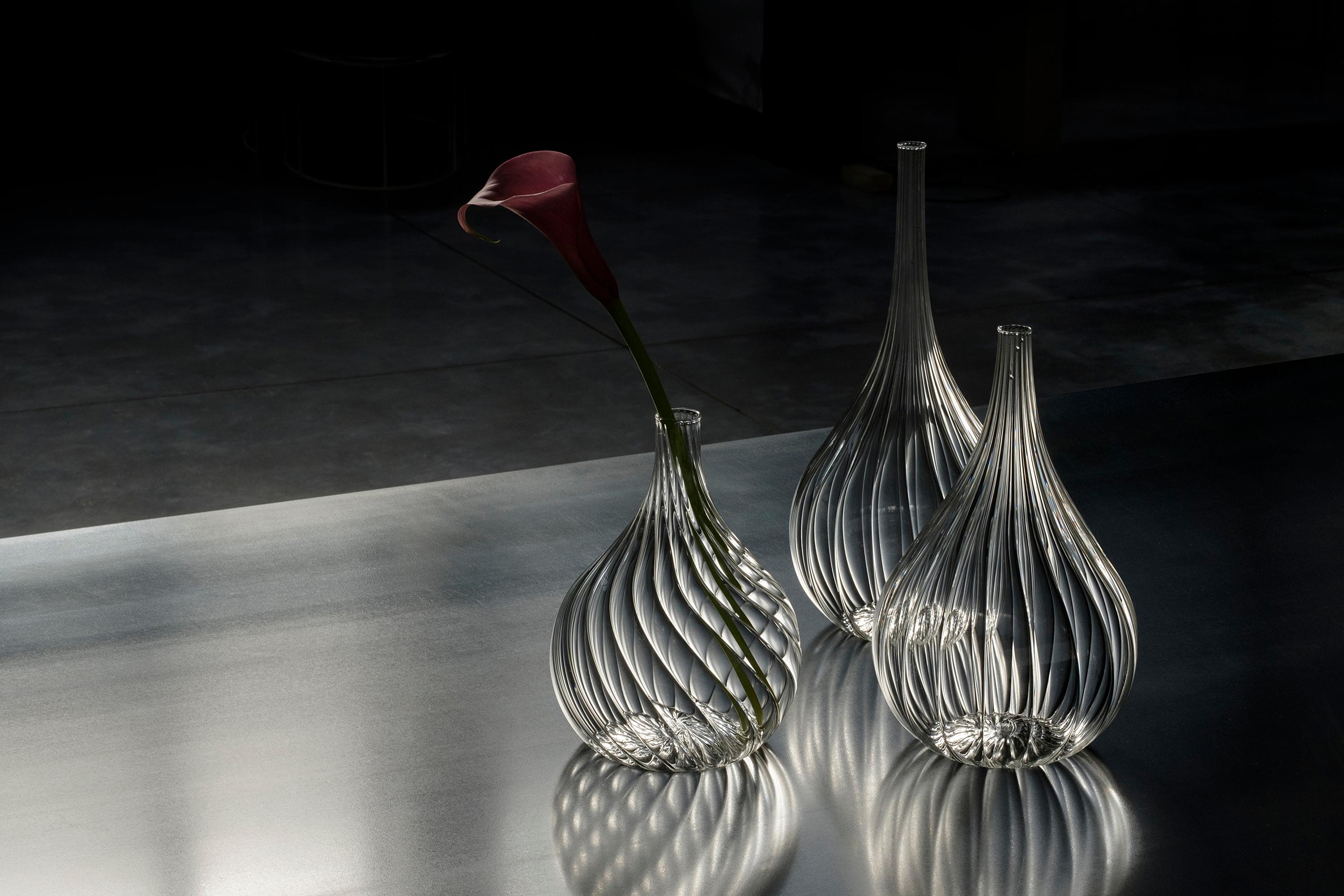 Lukovki is a set of three vases inspired by the tops of St. Basil’s Cathedral on Moscow’s Red Square. Made of striped borosilicate, the alternation of texture in the three pieces makes them dynamic and light. Lukovki vase set is designed by Design