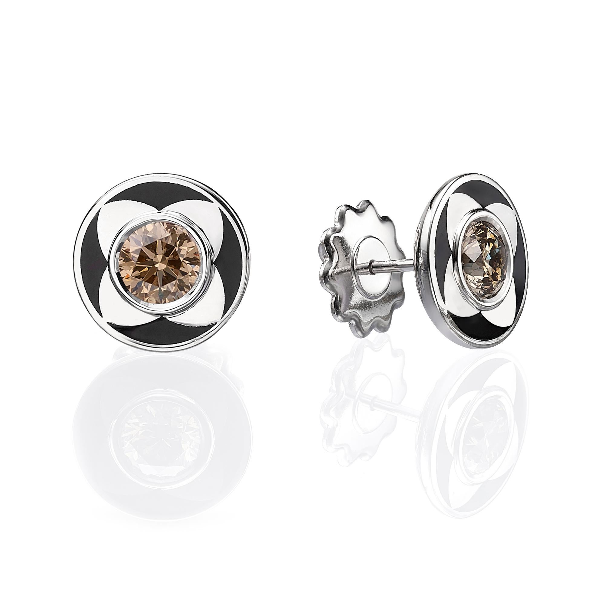 SKU# 4006122

Elegant stud earrings are made of 18k white gold and feature a unique design that combines the sparkle of diamonds with the boldness of black enamel. The enamel is skillfully applied to form a beautiful flower shape, creating a
