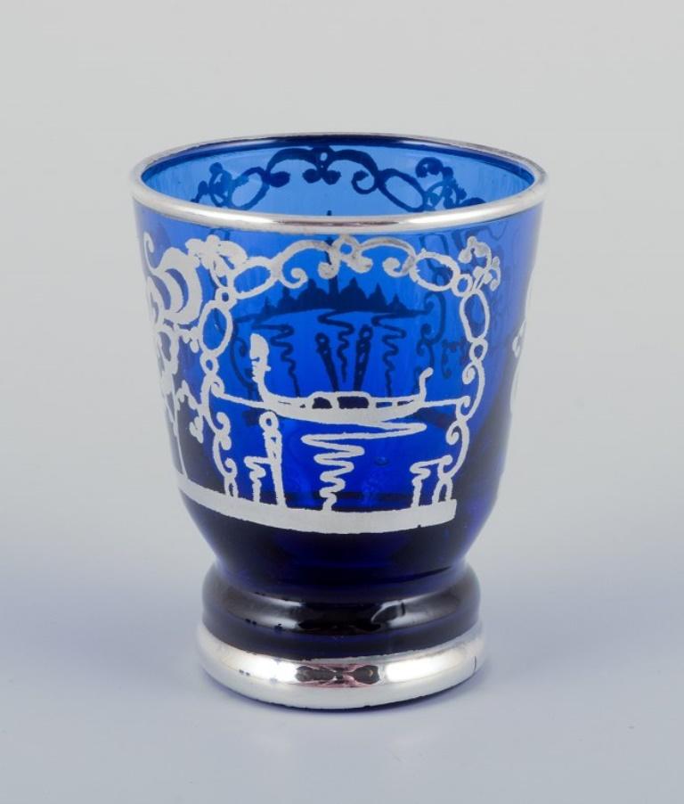 Glass Venice, Italy. Liqueur set in blue glass: decanter and five cups. Mid-20th C.